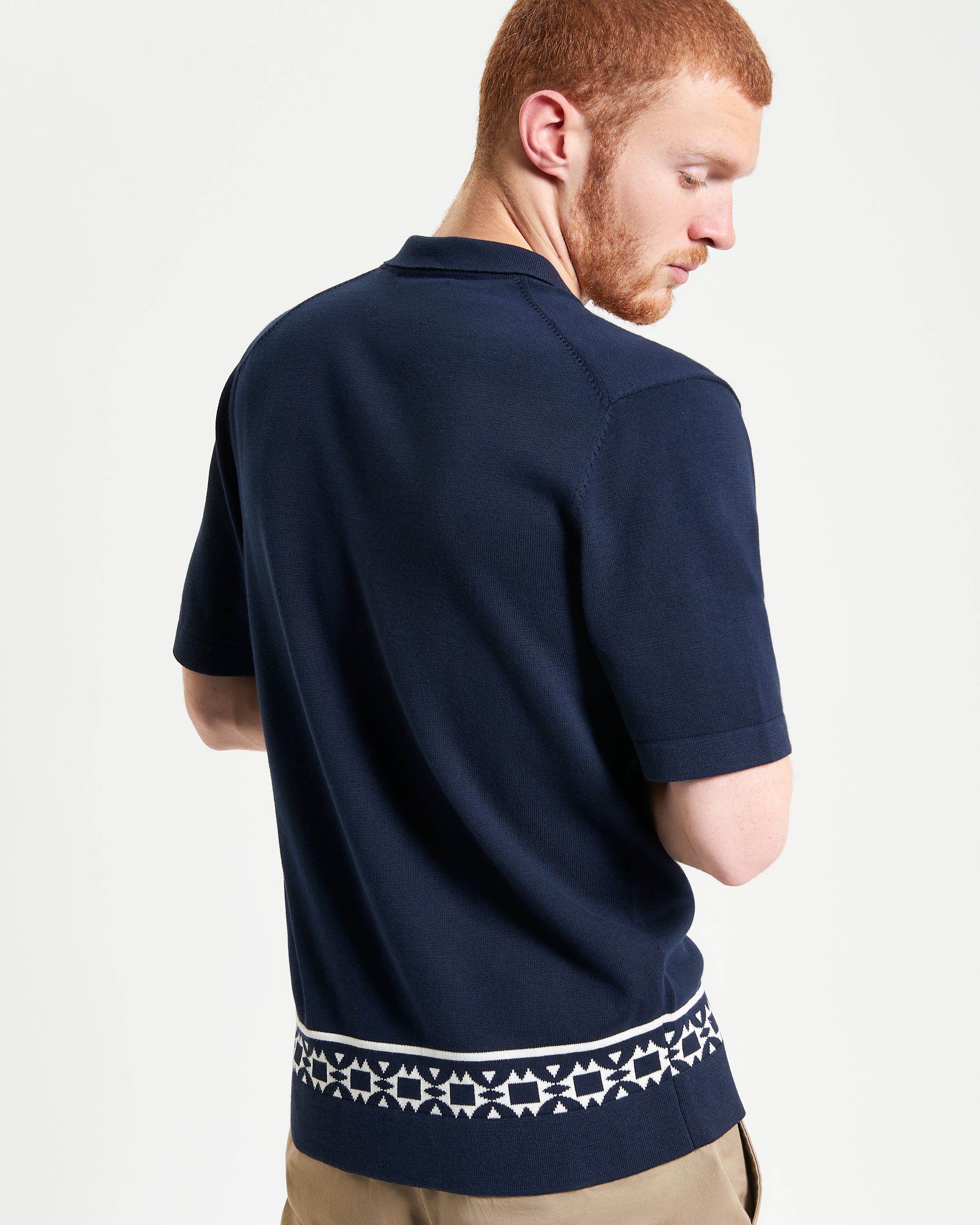 Floral Border Resort Shirt – navy blue – short-sleeve knitted shirt featuring geo border print on the bottom.