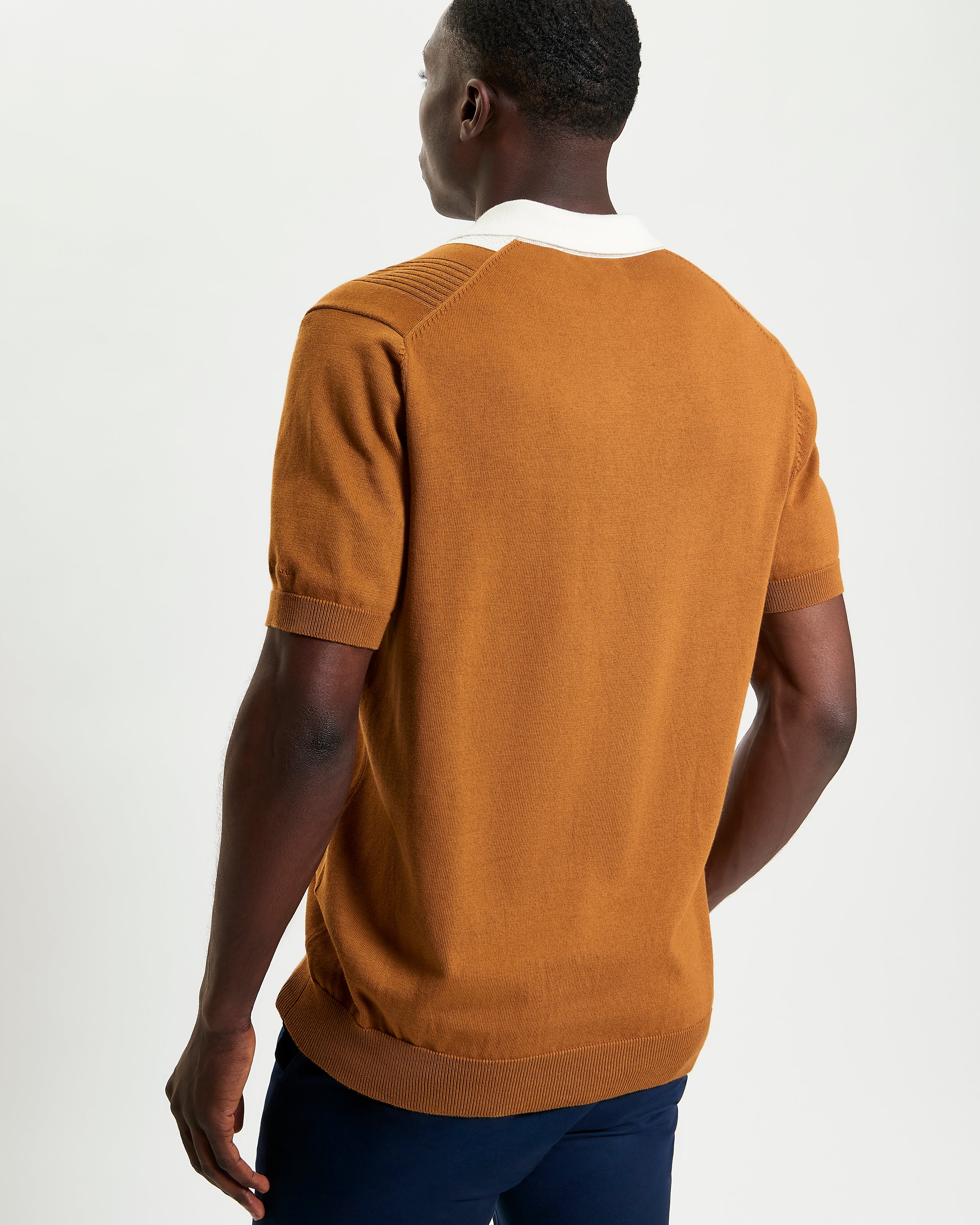 Textured Block Stripe Polo – short sleeve polo in brown with raised block-stripe texture and white collar.