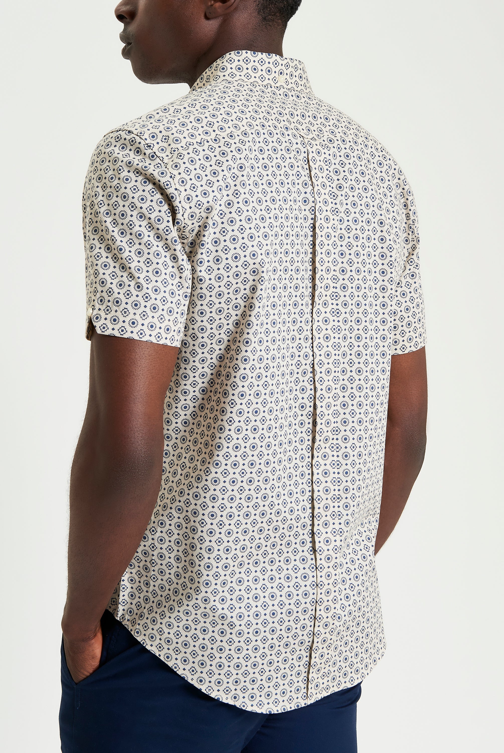Block Geo Print short sleeve shirt with a stylish pattern and curved hem viewed from the back.