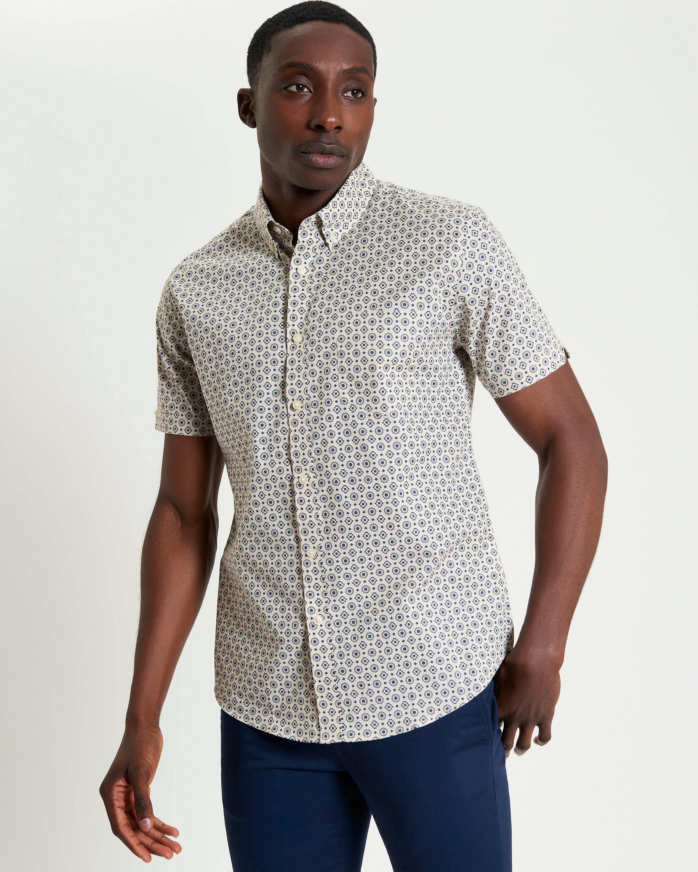 Block Geo Print short sleeve shirt on model, featuring a unique graphic pattern and button-down collar.