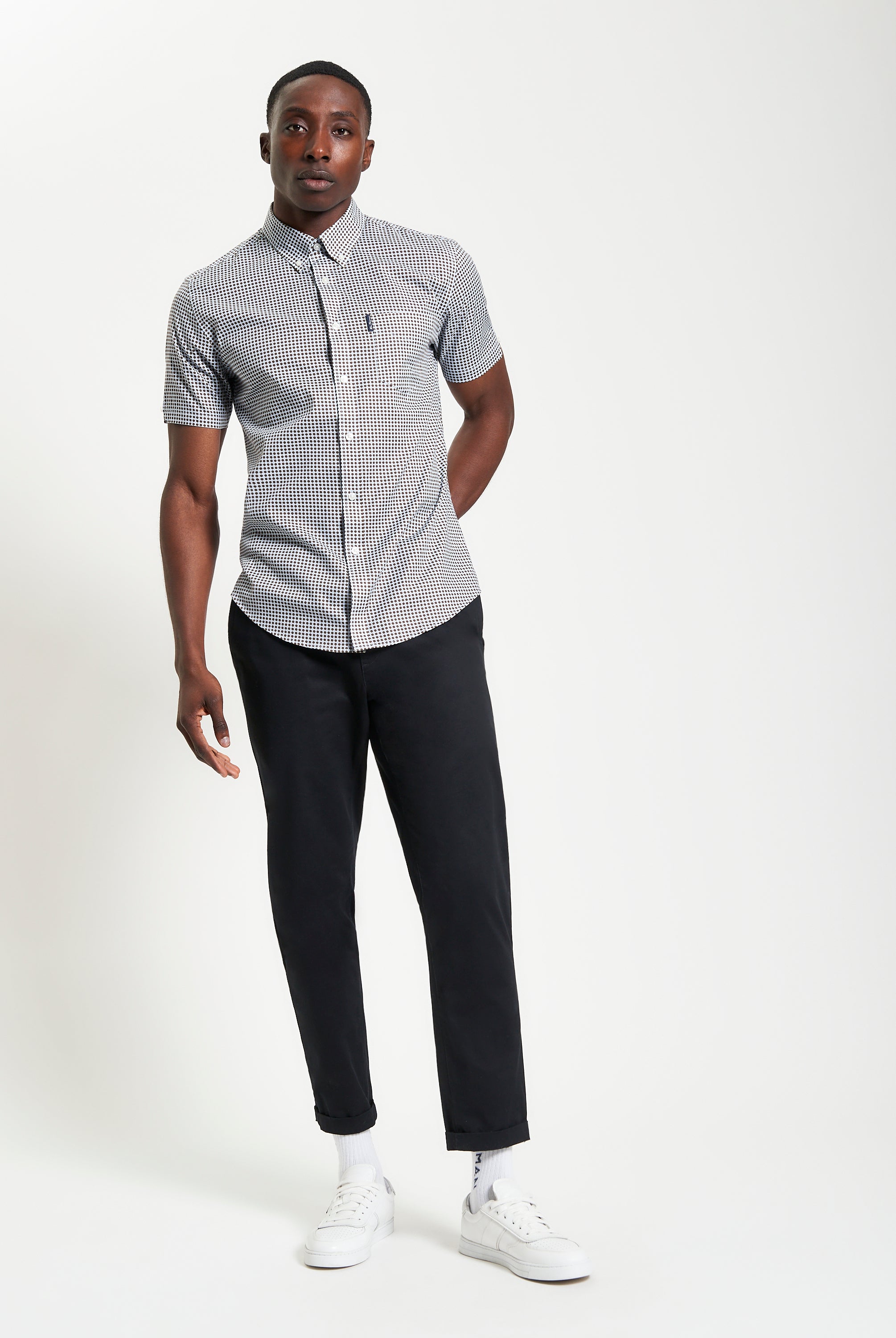 Geo Print shirt worn by model, showcasing modern tailoring with a two-finger collar and Ben Sherman pocket.