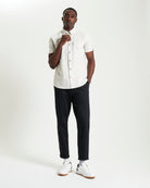 Split Geo Print short-sleeve shirt from Ben Sherman on a model, featuring a two-finger button-down collar.
