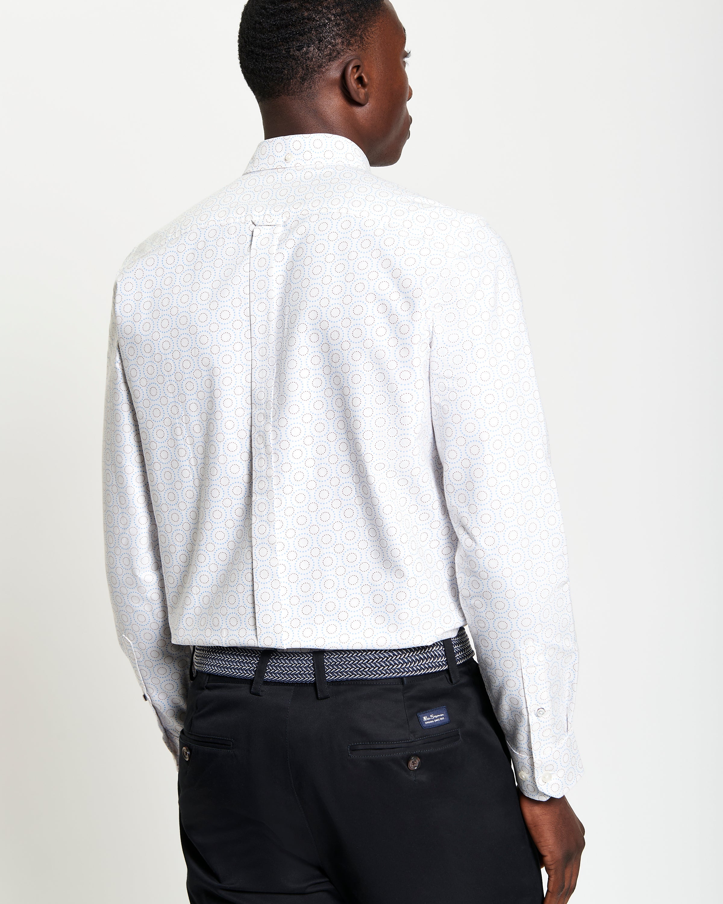 Stipple Spot Print – long sleeve shirt showcasing modern fit and curved hem, features playful print and classic button-down collar.