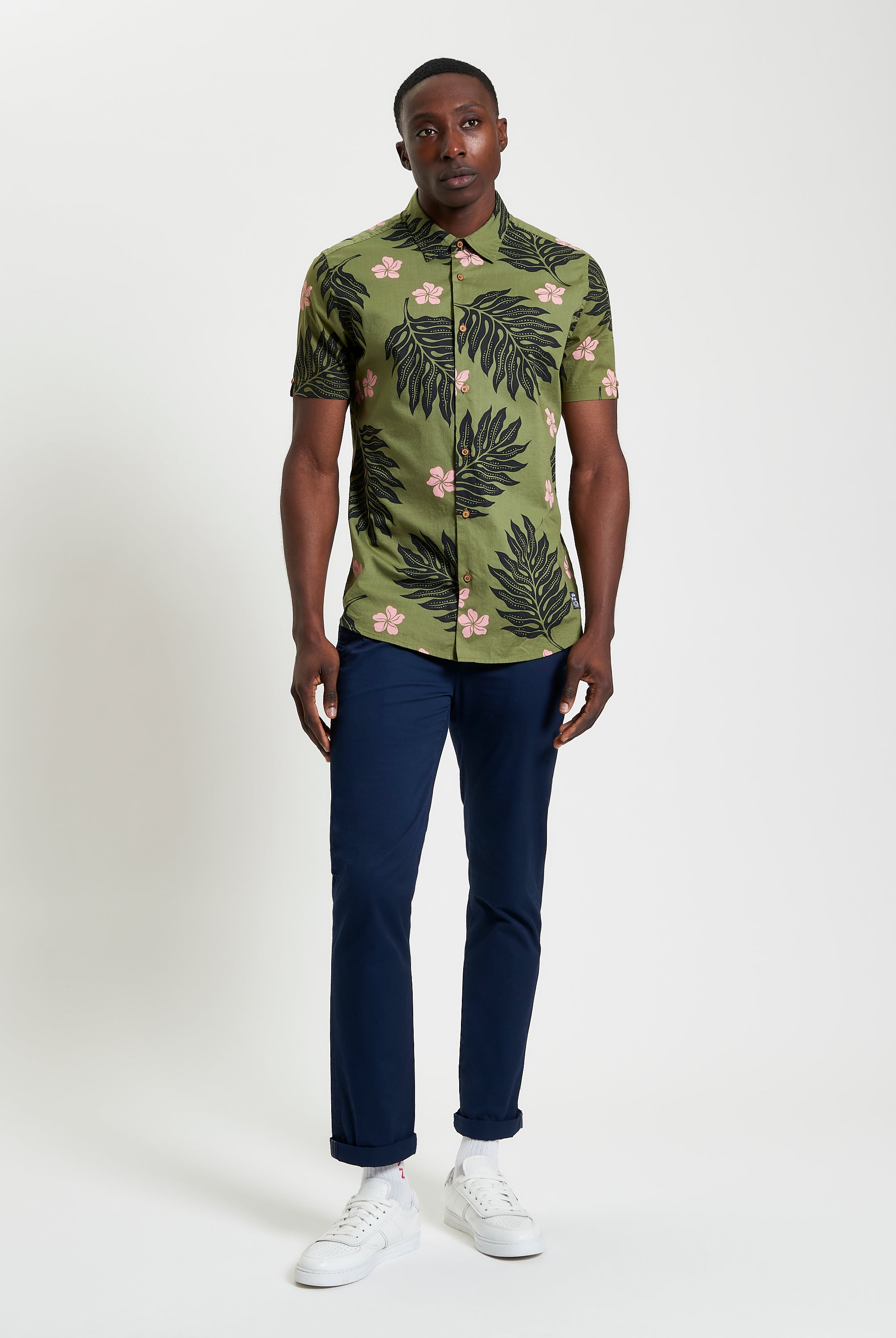 Botanical Print Shirt on model featuring short sleeves and bold botanical pattern, perfect for summer style.