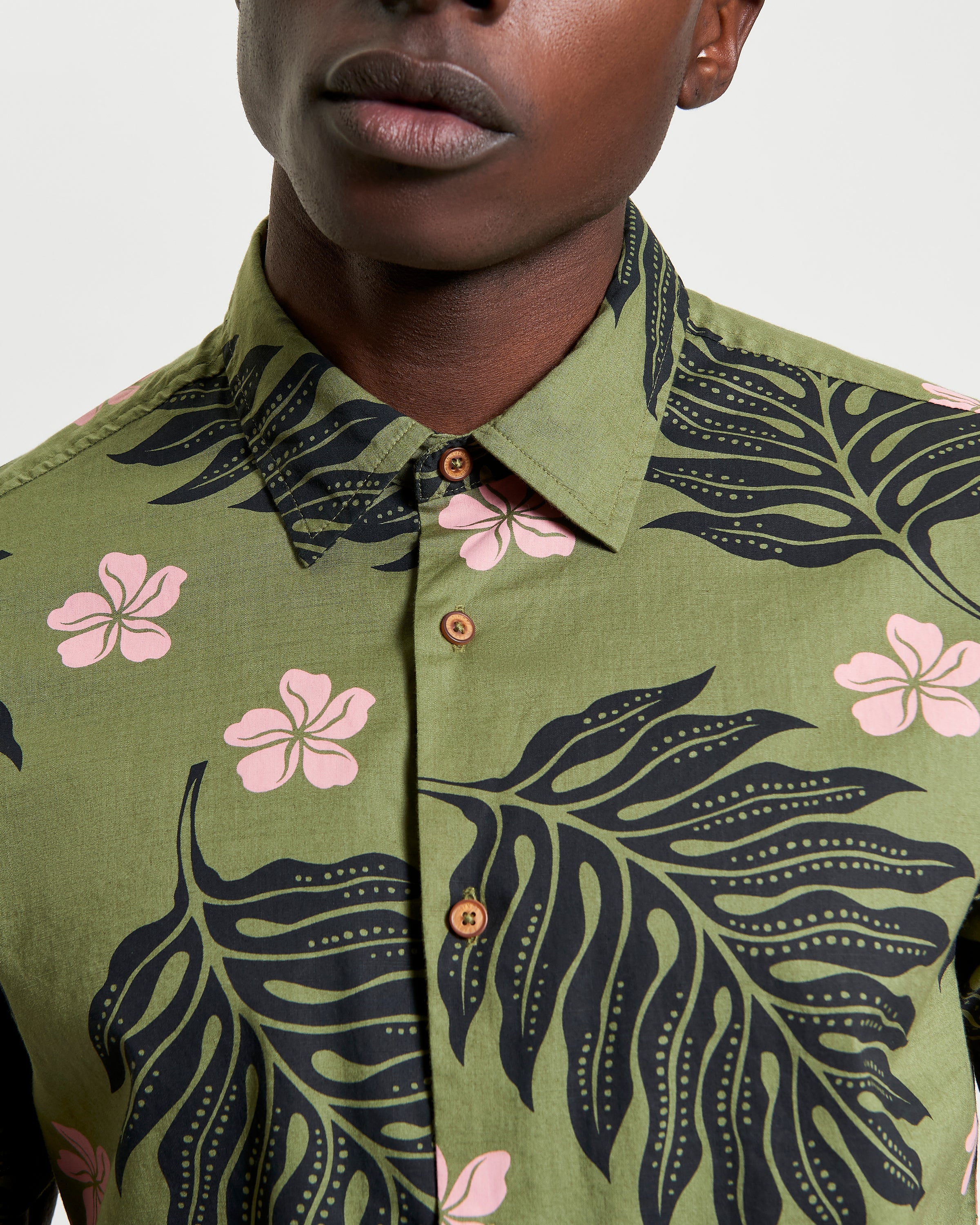 Botanical Print Shirt featuring bold floral and leaf patterns, perfect for summer styling and casual occasions.