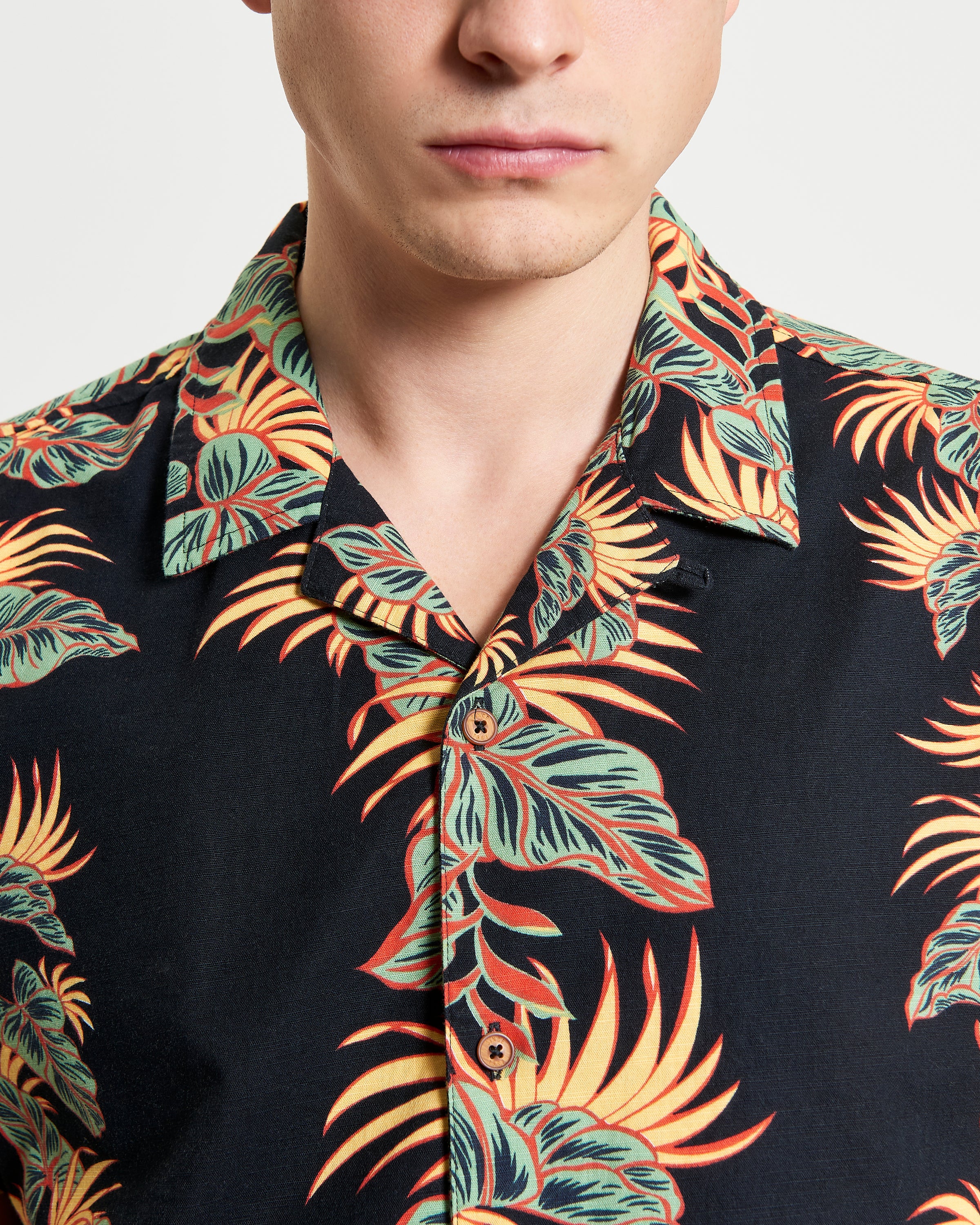 Botanical Leaf Print short sleeve shirt featuring bold leaf motif and revere collar, perfect for summer style.