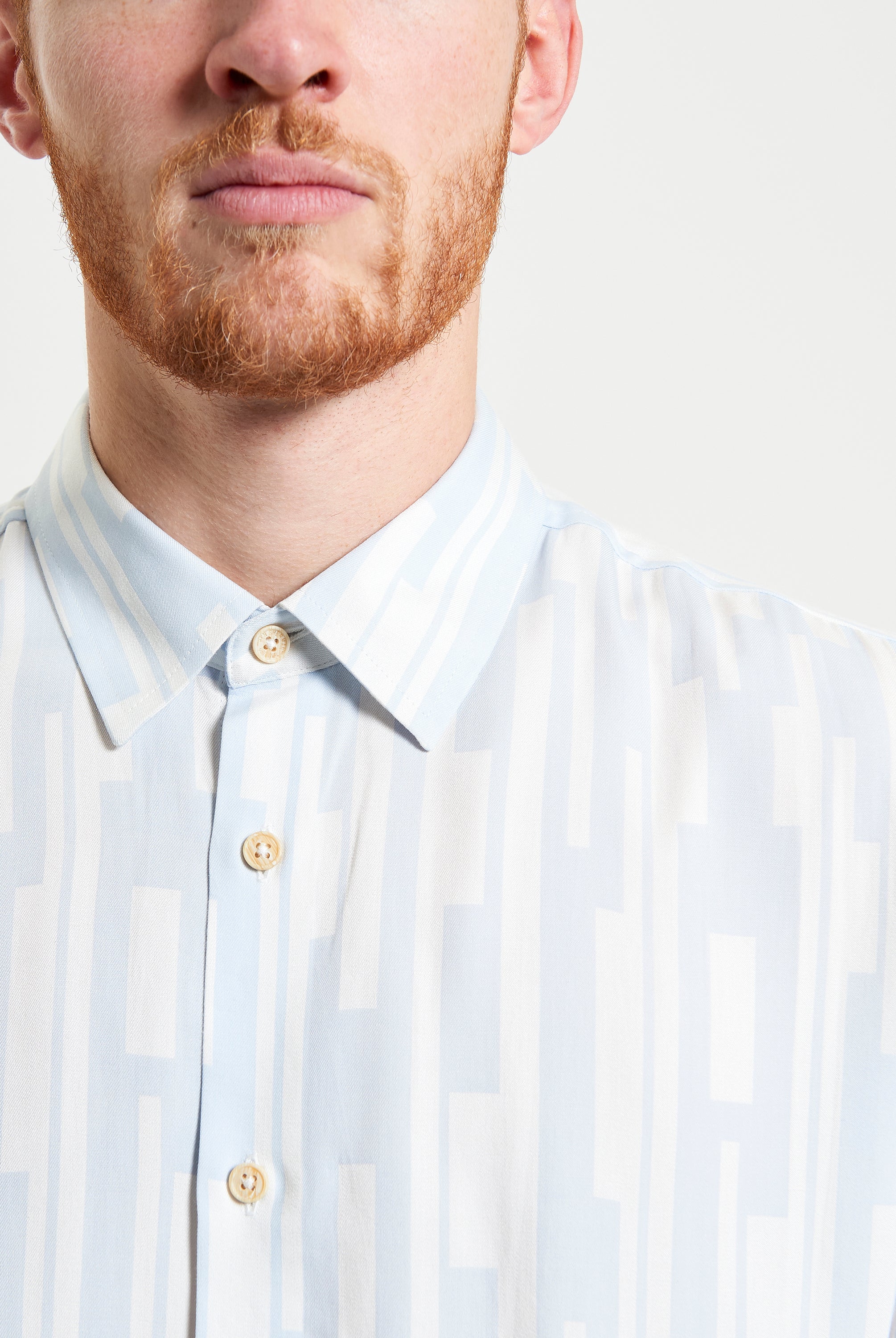Jazz Lines Print shirt featuring bold graphics and a button-down collar for a stylish smart-casual look.