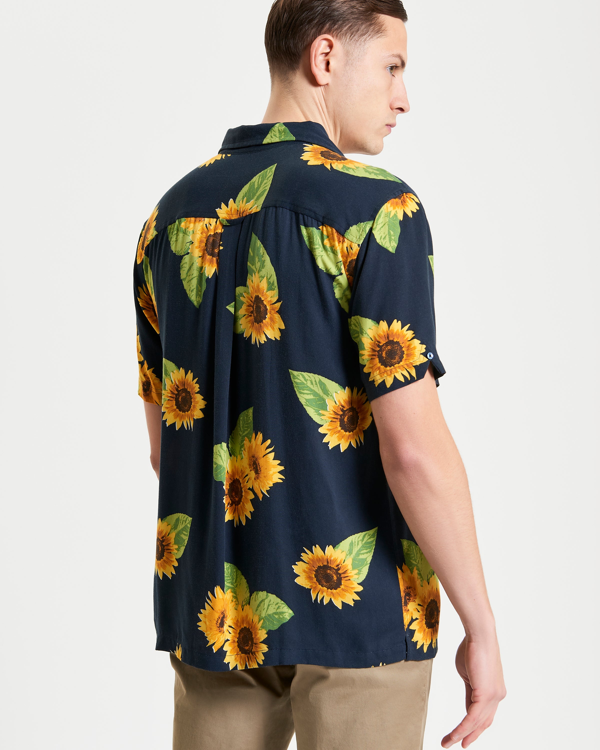 Sunflower Print – Back view of the shirt featuring a vibrant sunflower pattern.