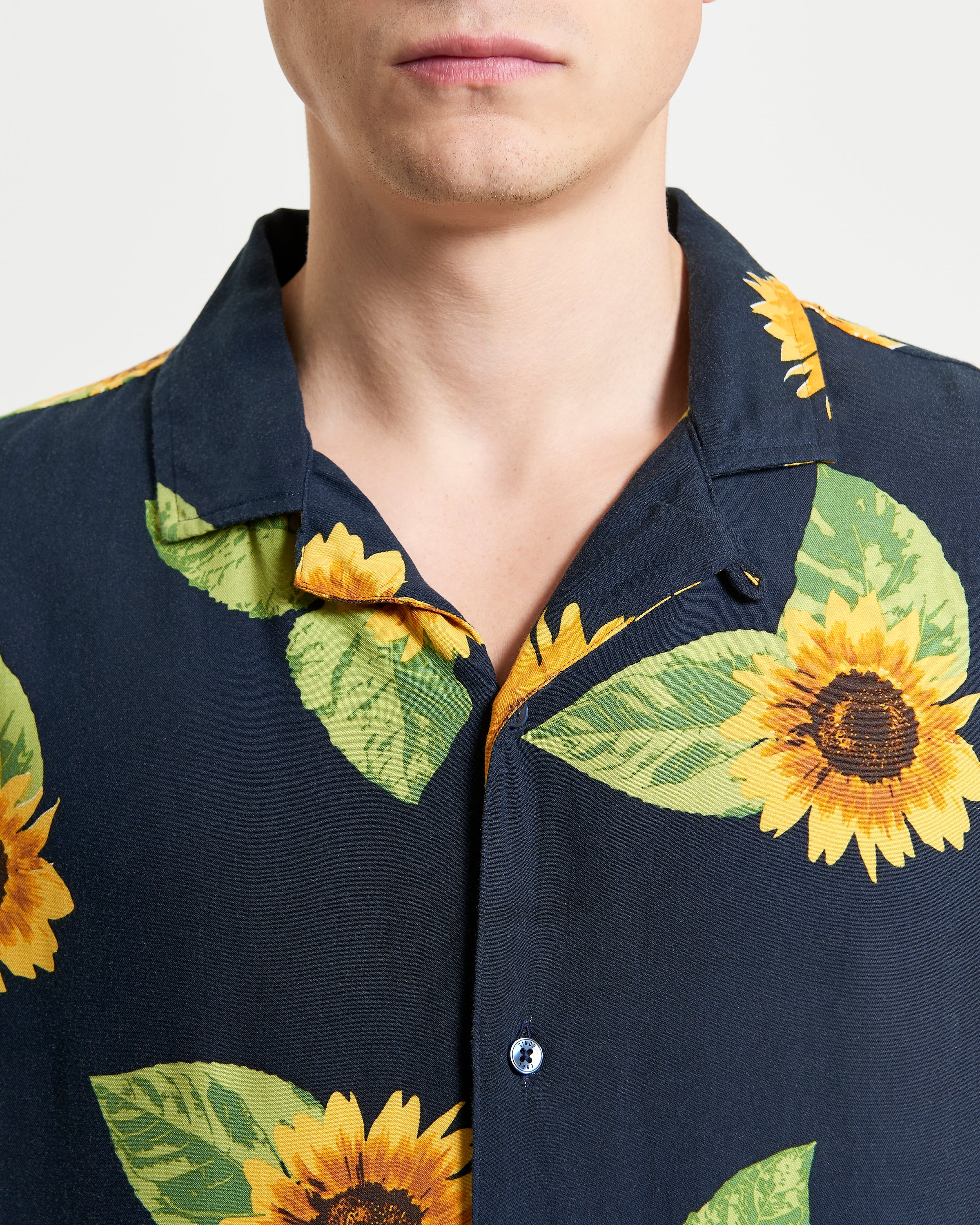 Sunflower Print – Front view of relaxed fit shirt featuring vibrant sunflower design and open collar.