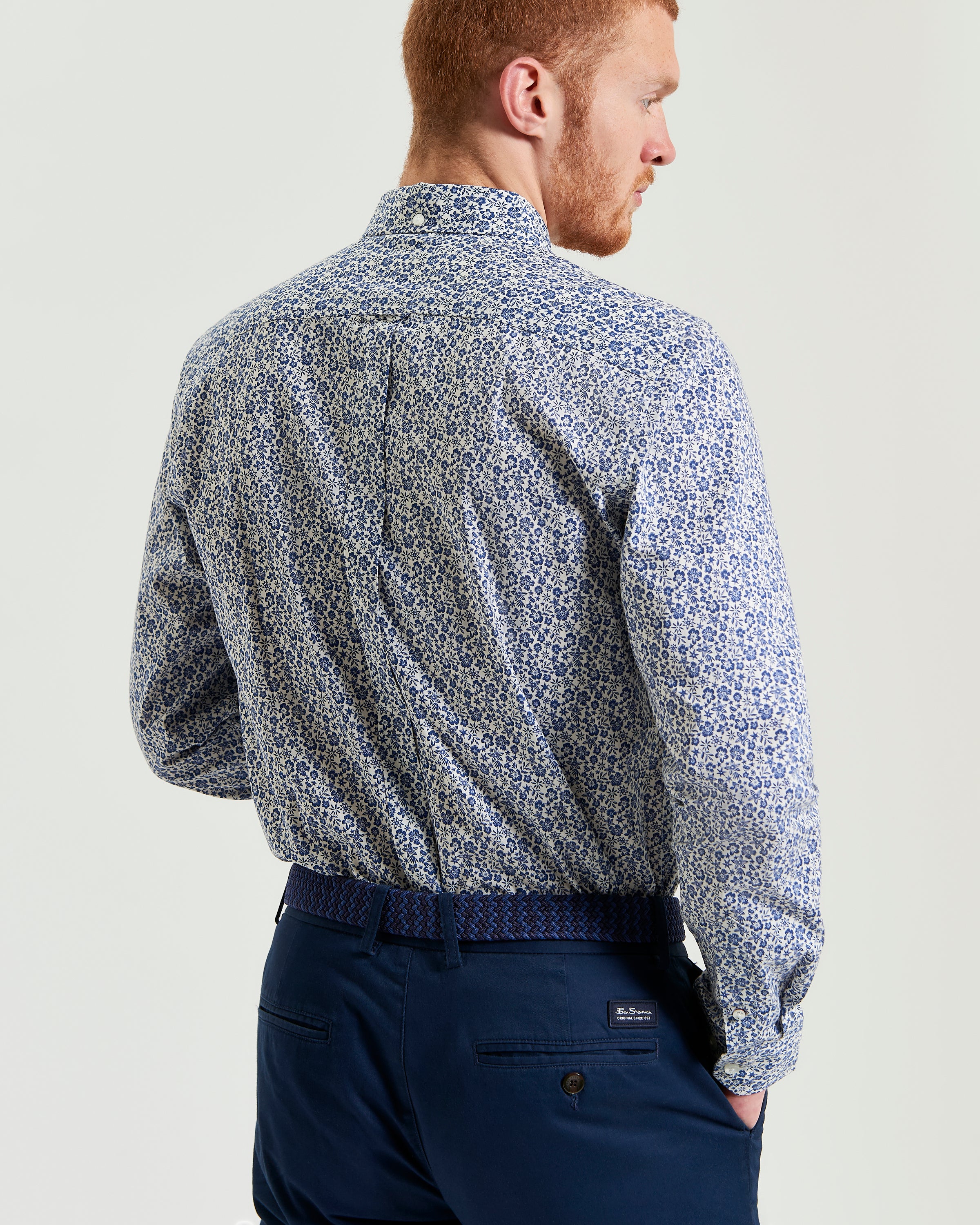 Mono Floral Print – back view of a man wearing a long-sleeve shirt in a subtle floral design.