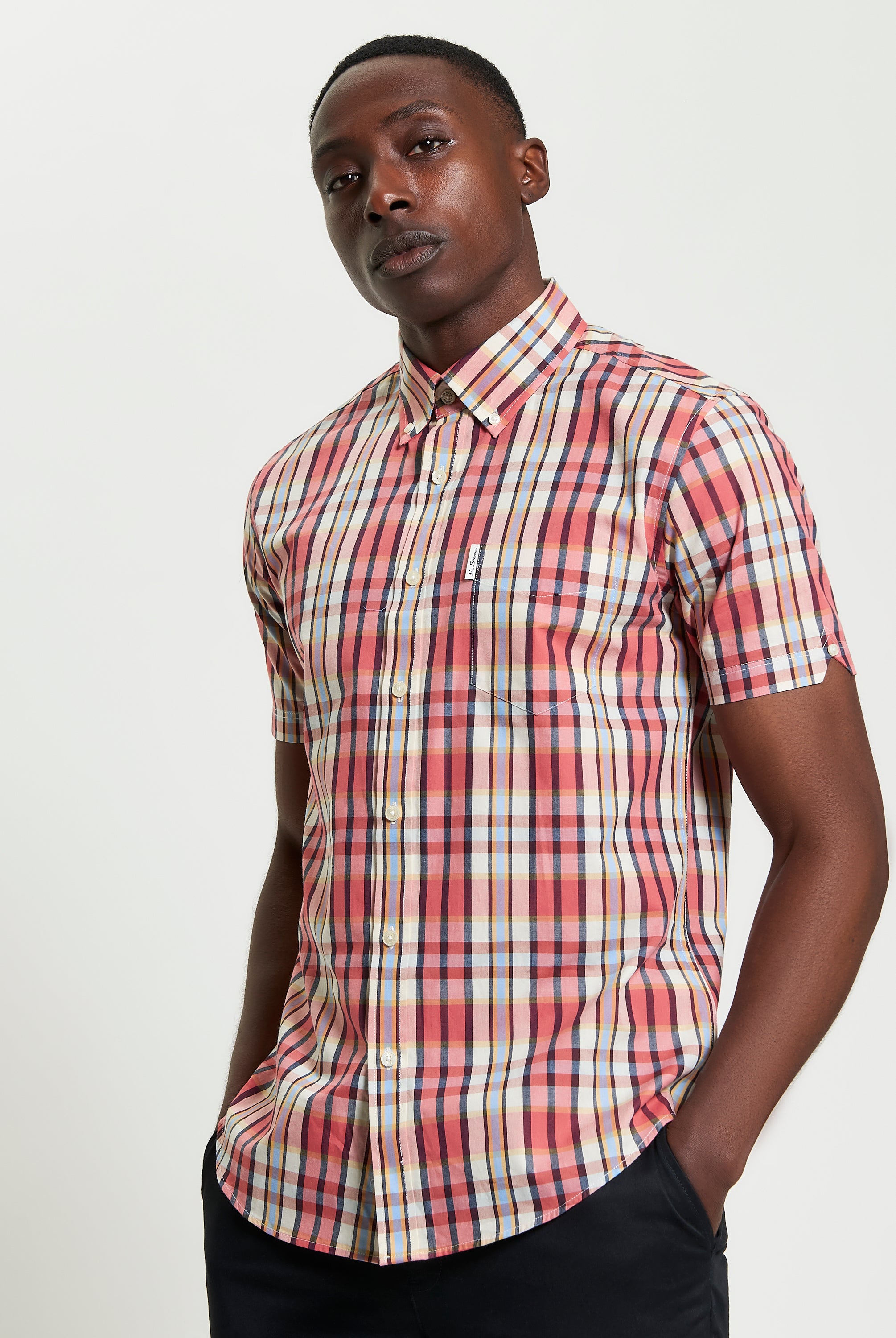 Irregular Check shirt in a stylish red and blue pattern, featuring a curved hem and button-down collar.