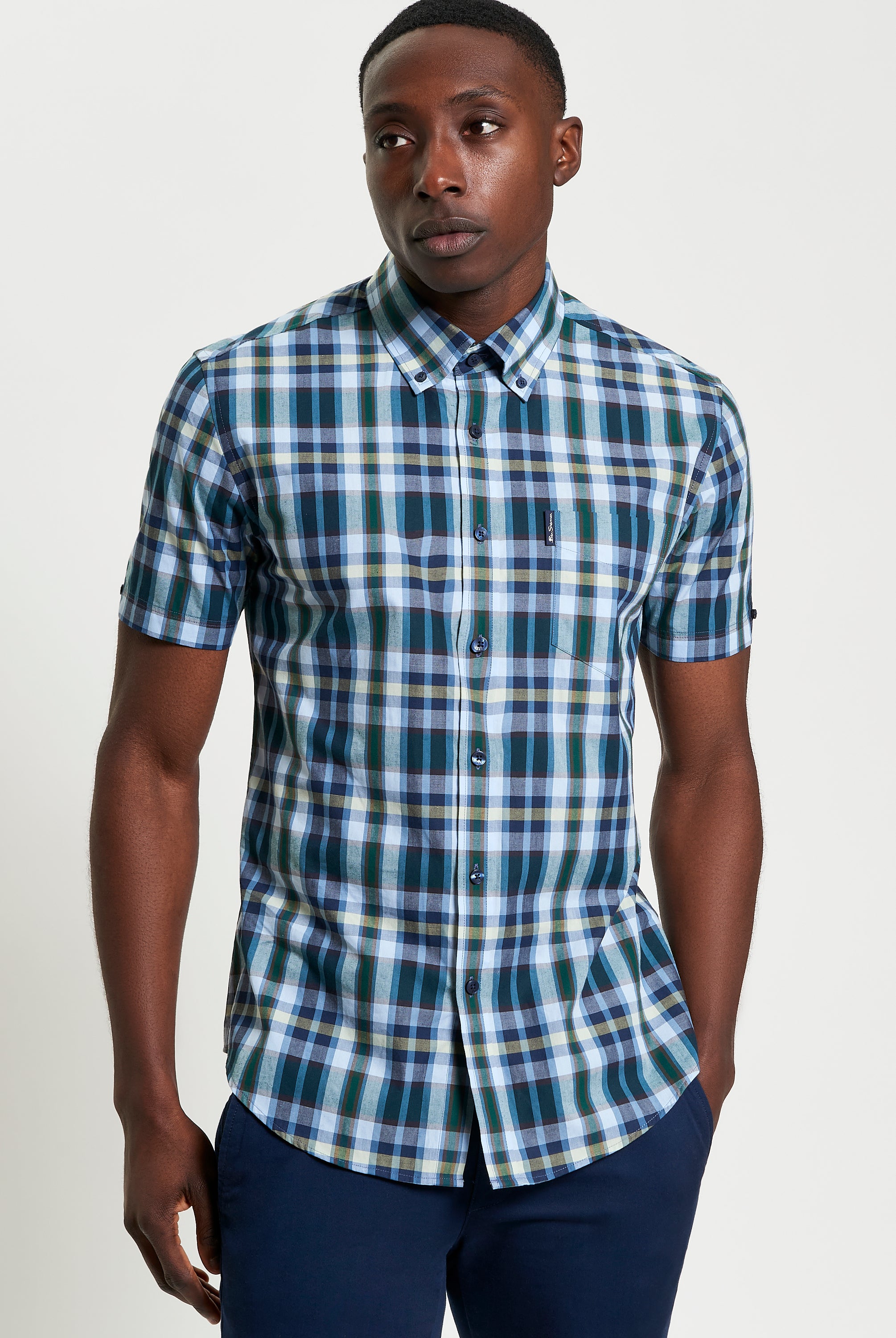 Irregular Check shirt worn by a model, featuring a modern plaid pattern on organic cotton.