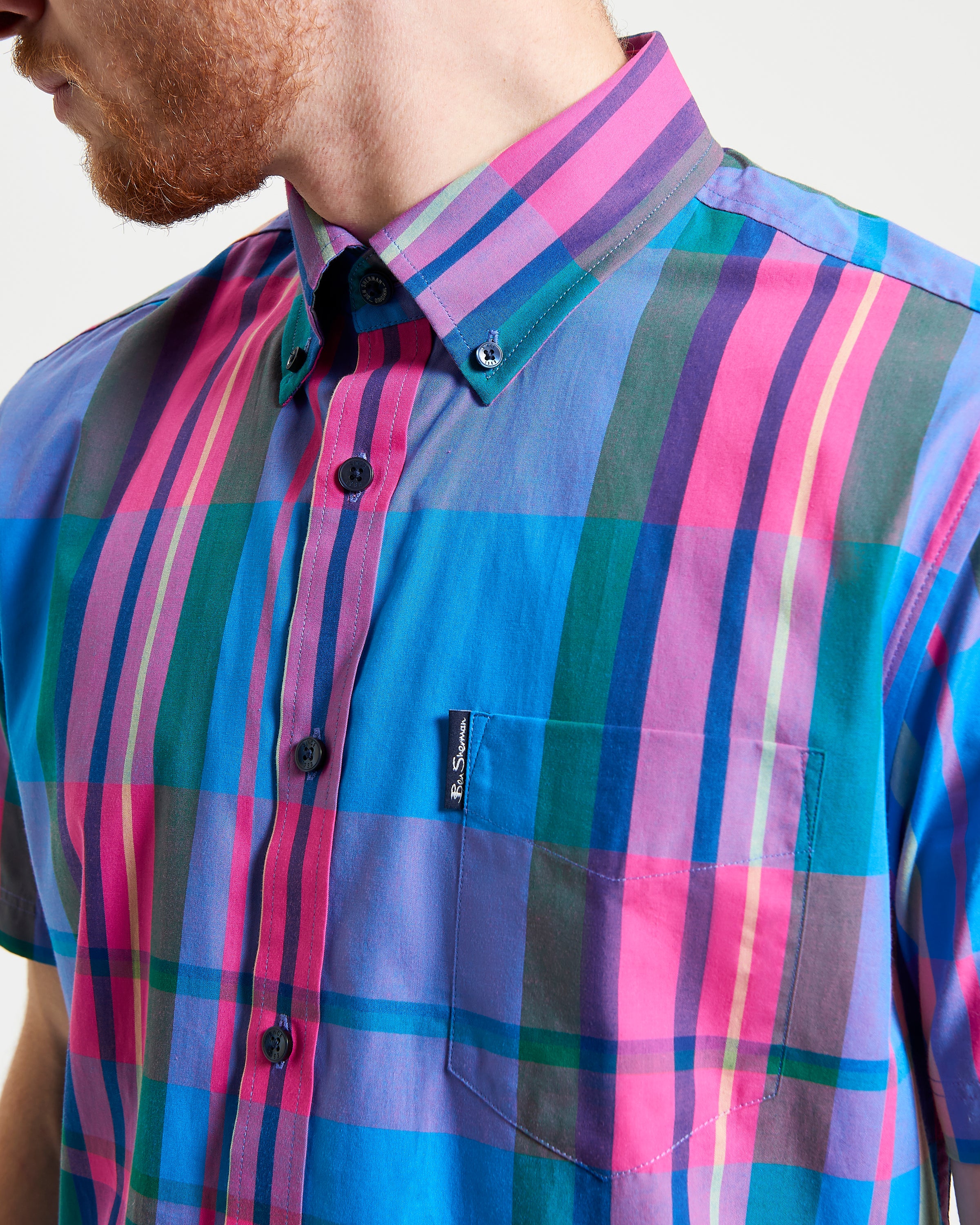 Large Madras Check short sleeve shirt showcasing vibrant plaid pattern and classic three-finger button-down collar.