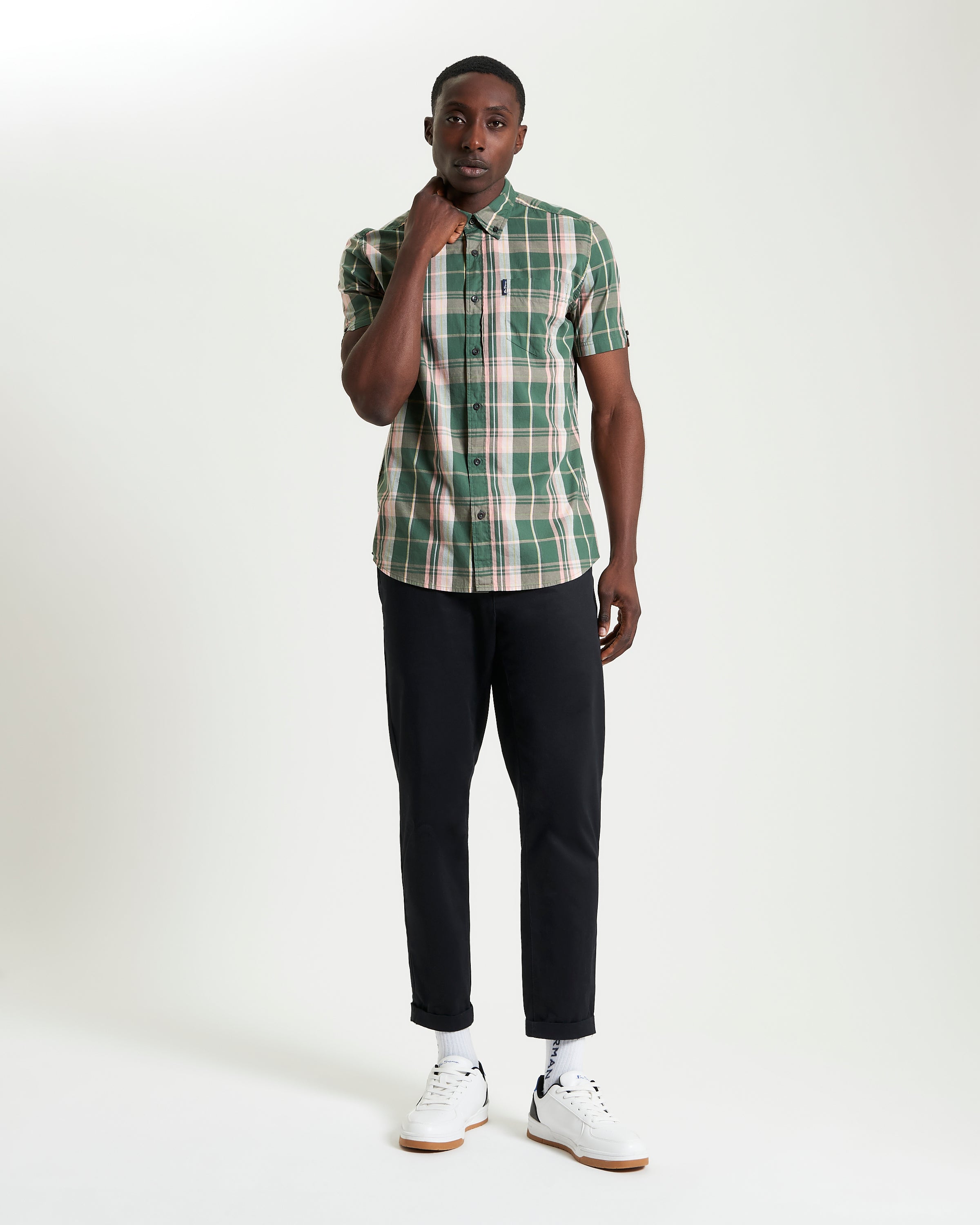 Slub Check short sleeve shirt in green plaid worn with black trousers, showcasing a casual and stylish look.