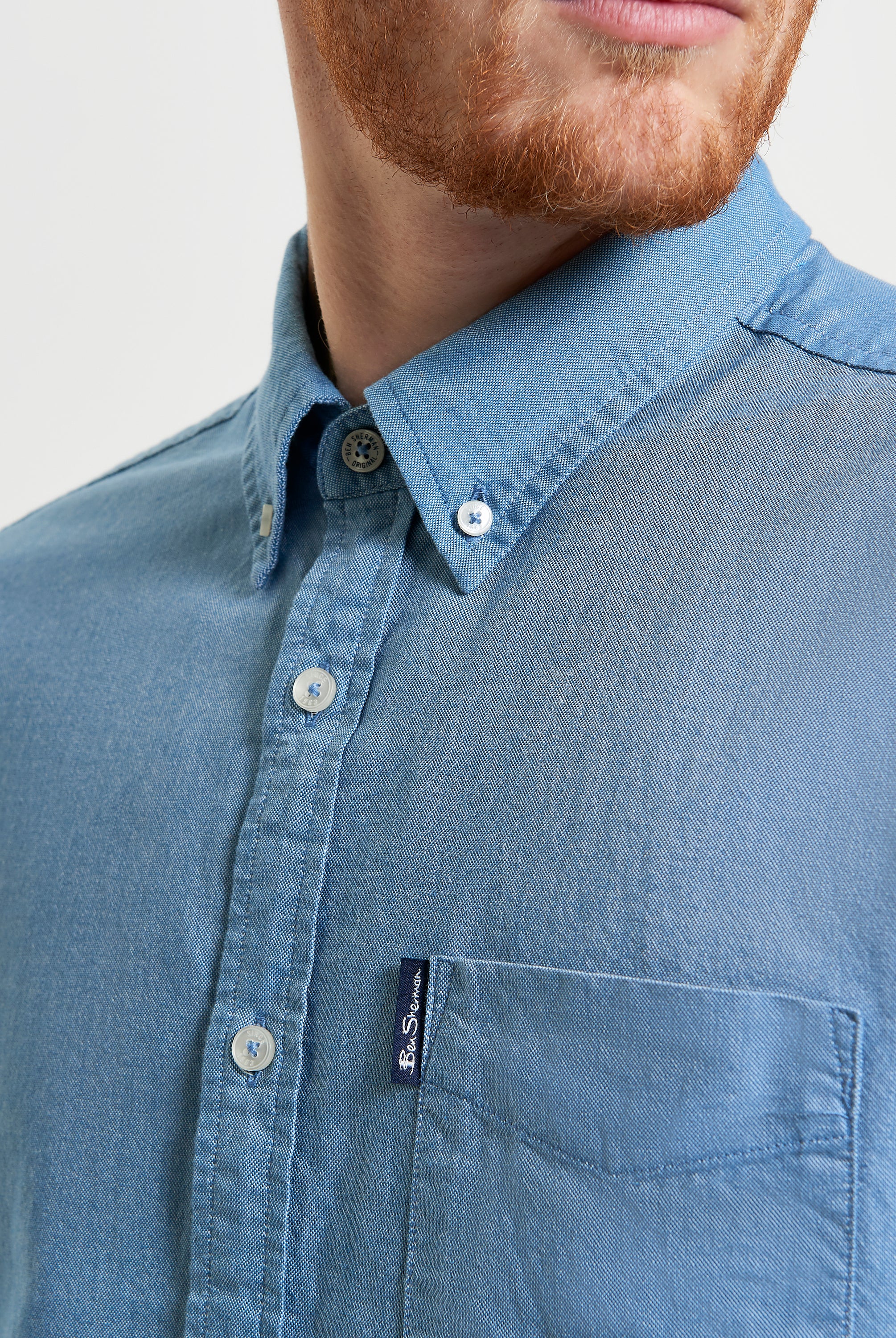 Signature Oxford Short Sleeve Shirt – Blue – featuring a button-down collar and chest pocket with woven label.