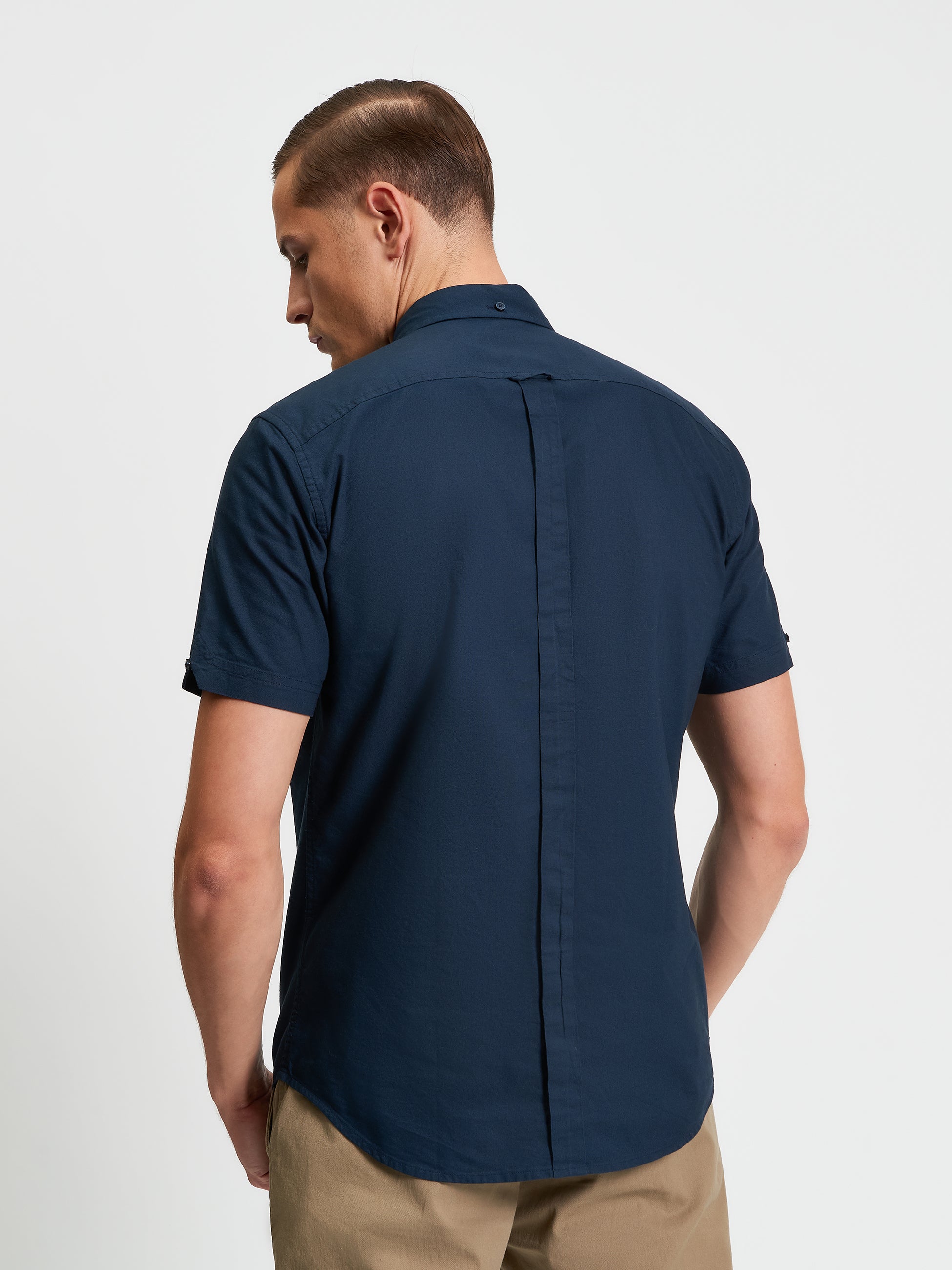 Signature Oxford Short Sleeve Shirt β Back view showcasing the minimalist design and organic cotton fabric.