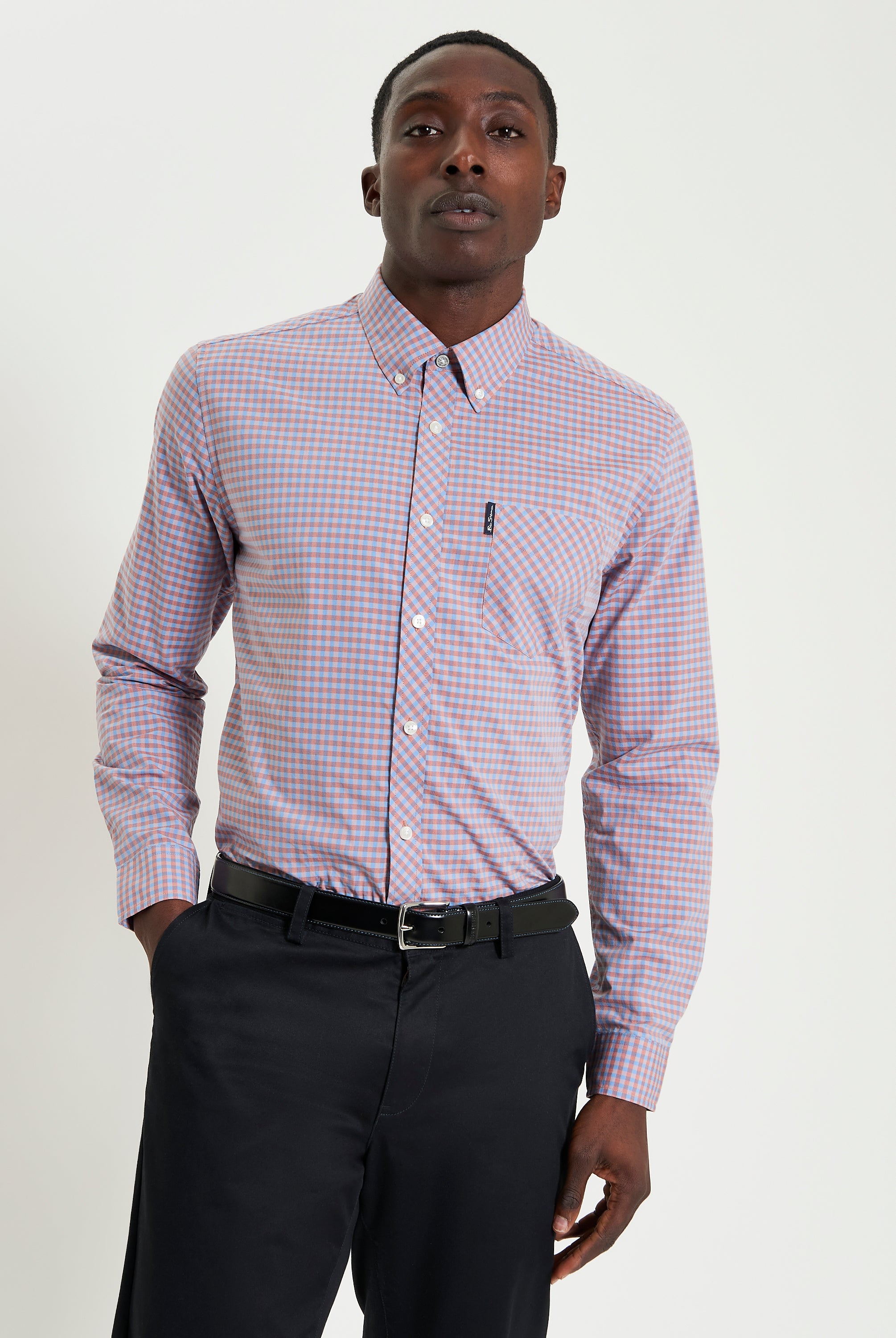 Signature Gingham Long Sleeve Shirt – modern fit with vibrant checks and classic details, worn with black trousers.