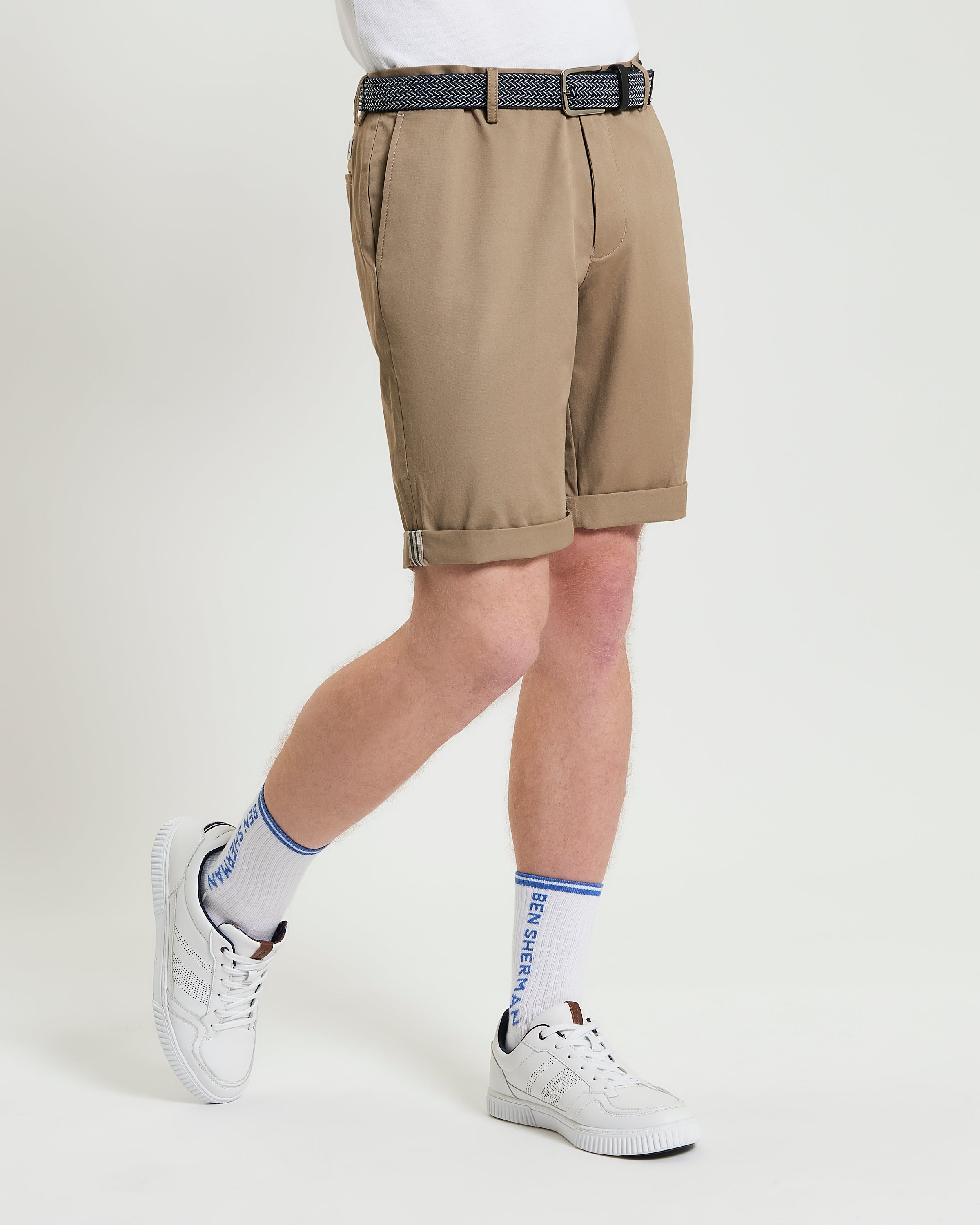 Signature Chino Short – tan chino shorts worn with a belt and white sneakers, perfect for summer outings.