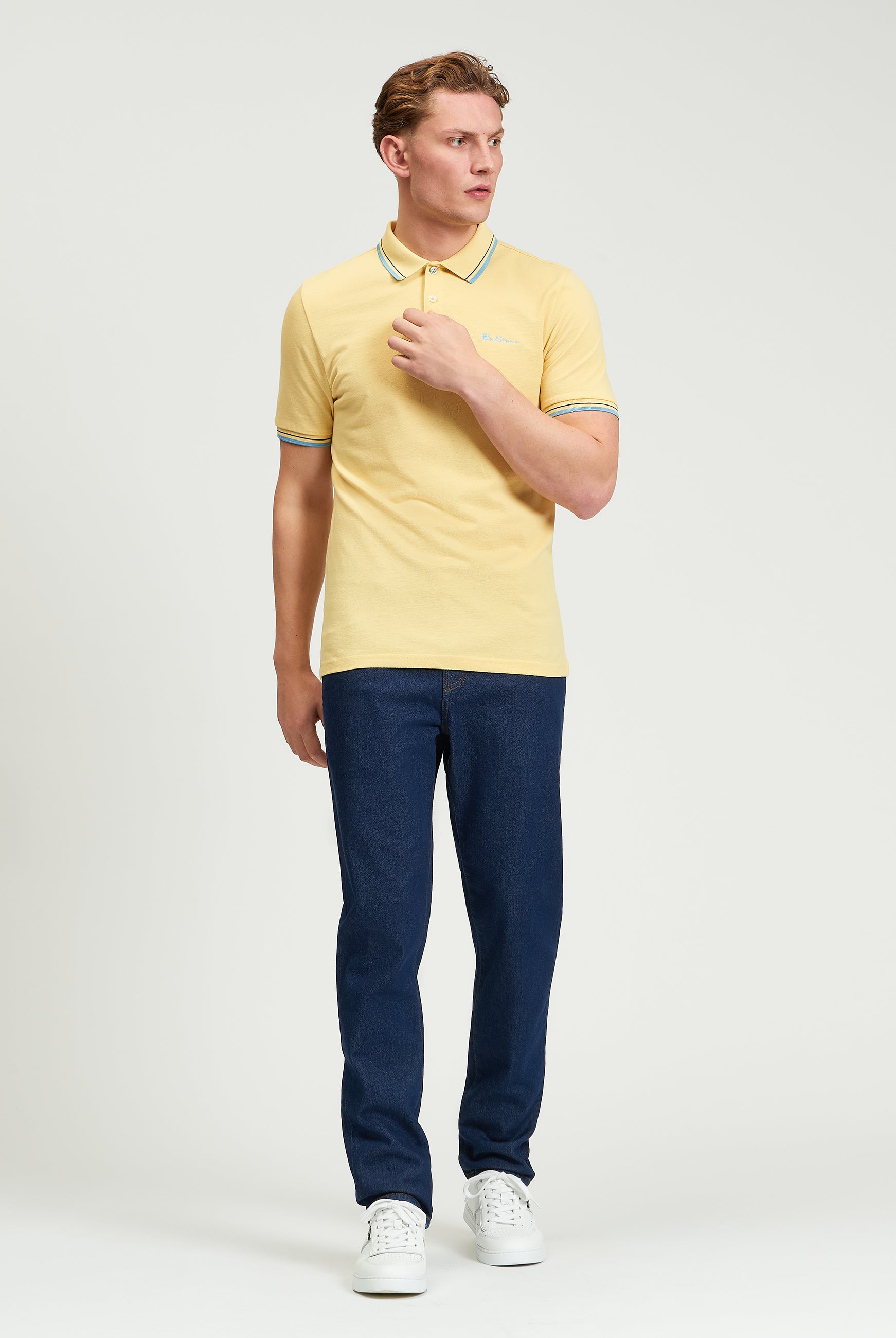 Signature Pique Polo β yellow and blue contrast detailing, worn by a model, perfect for casual wear.