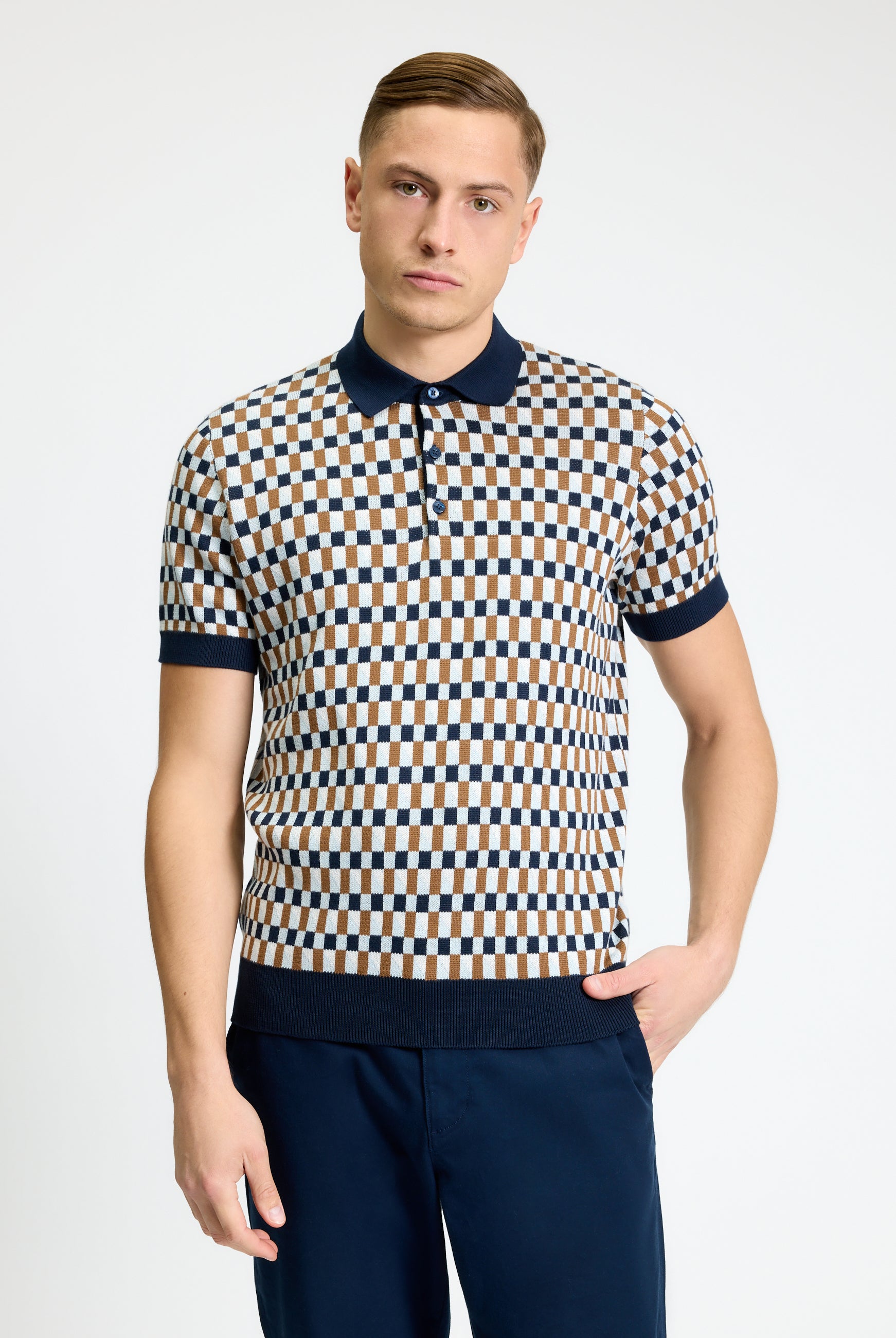 All Over Jacquard Polo – Men’s stylish jacquard knit polo shirt featuring a modern check pattern.