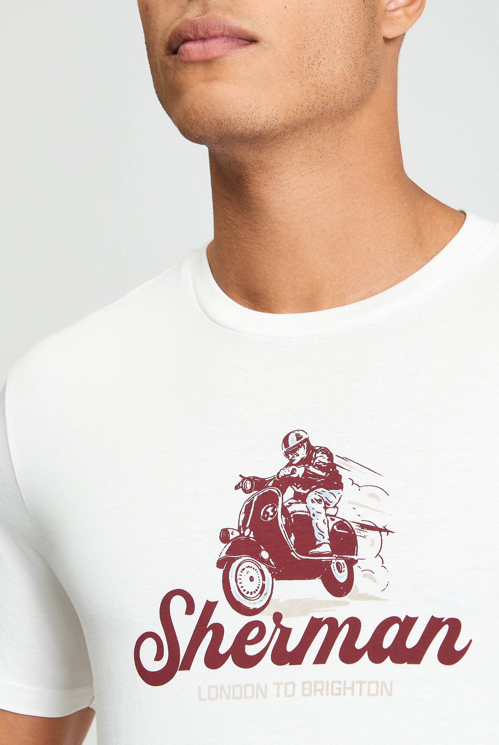 Close-up of Race Day Tee featuring mod-inspired print of a scooter and rider, highlighting Ben Sherman style.