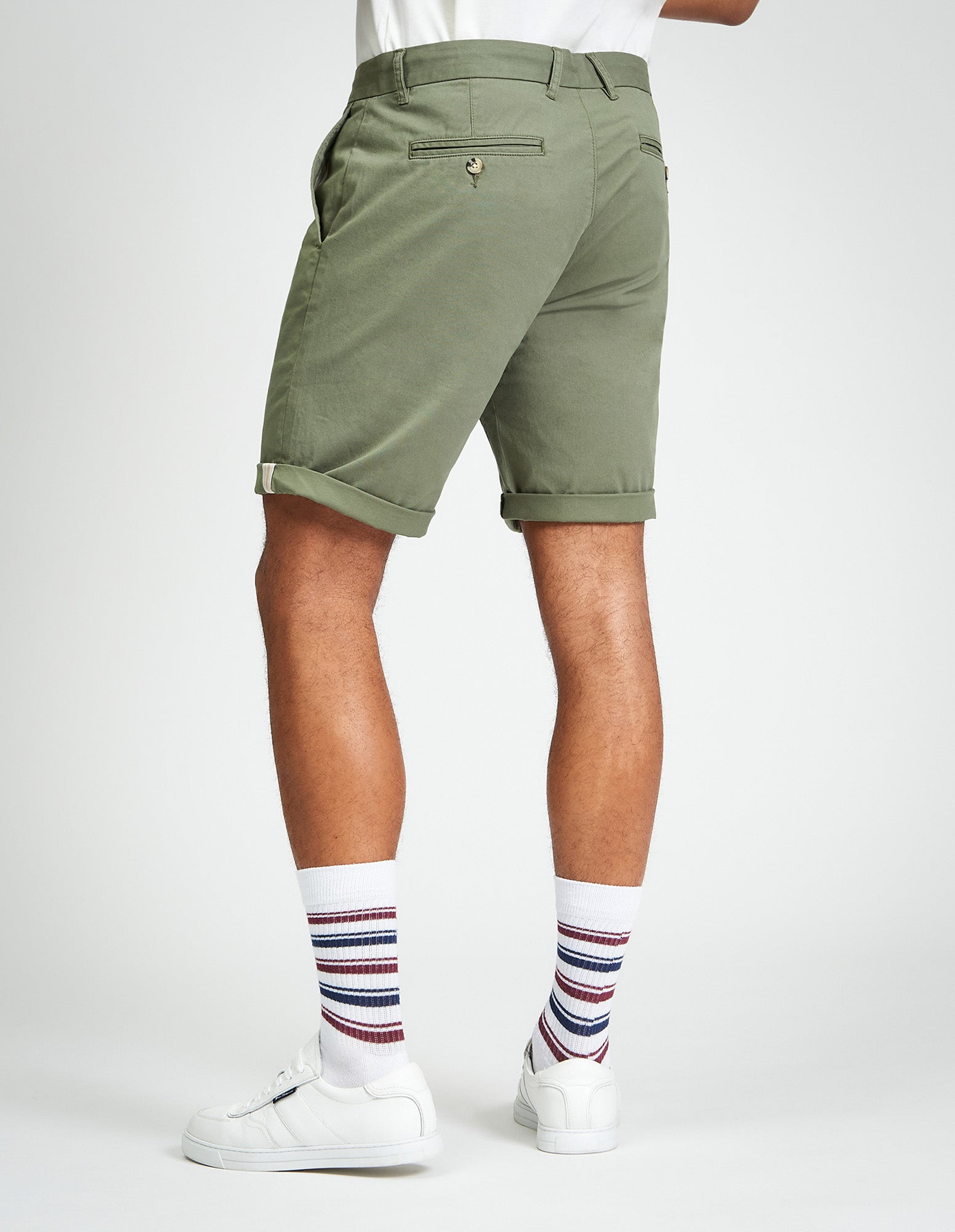 Signature Chino Short β olive green, showcasing clean tailoring and signature detailing at the hem.