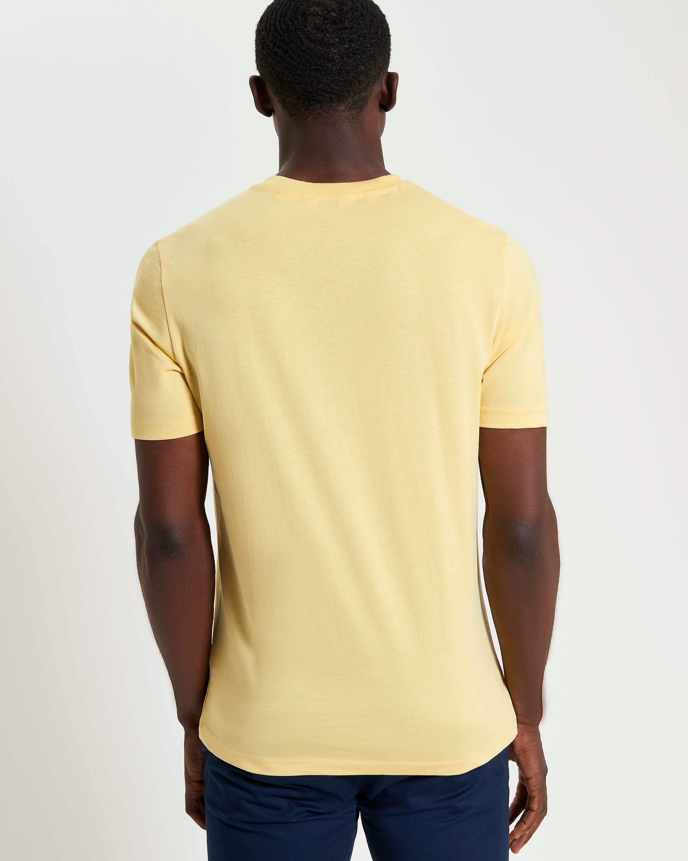 Signature Target Tee – Yellow – Back view showcasing the regular fit and crew neck design.