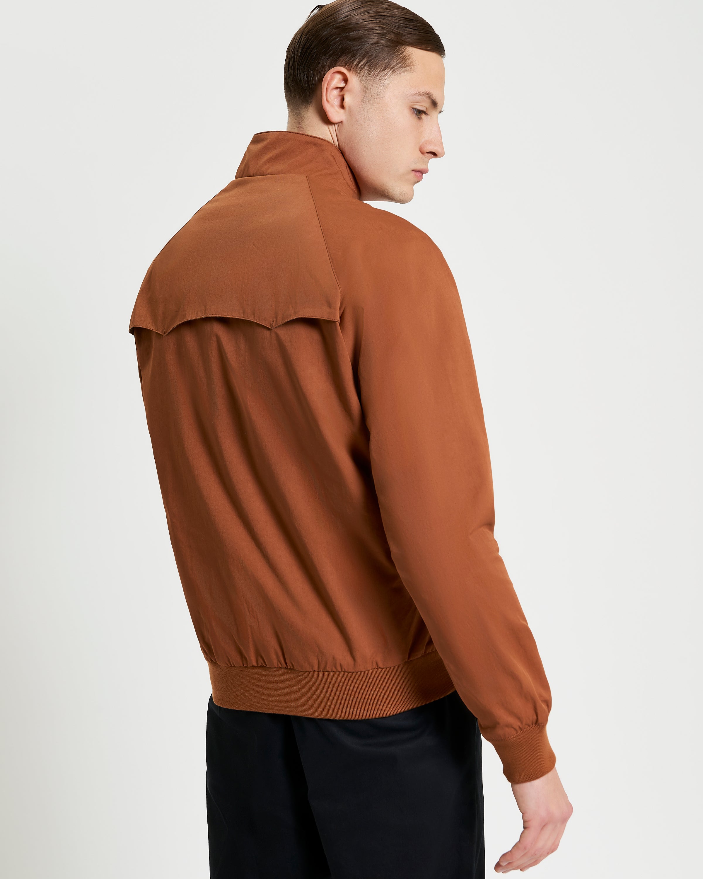 Back view of the Signature Harrington Jacket in brown, showcasing its stylish design and modern edge.