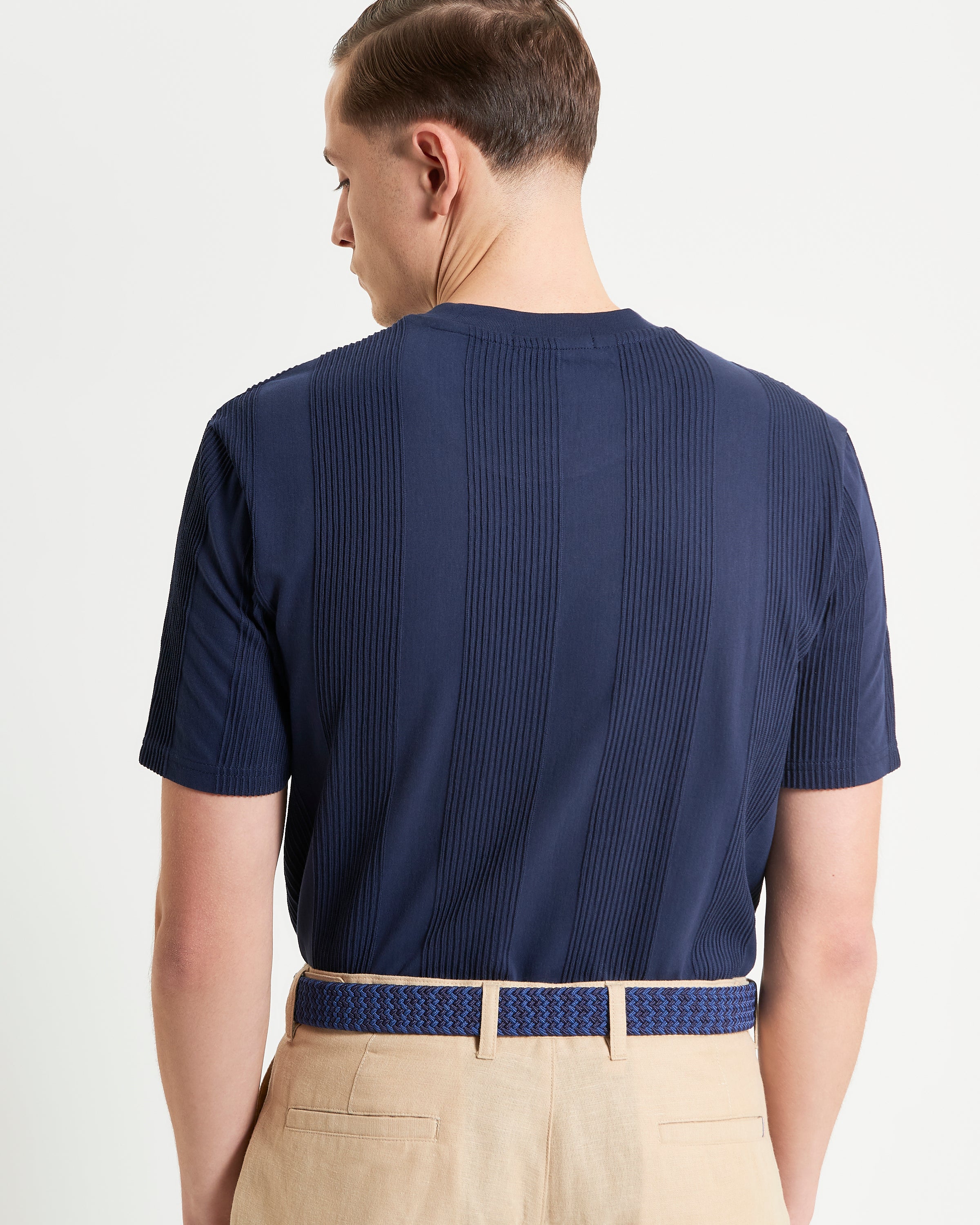 Textured Vertical Stripe Tee – relaxed fit with vertical stripe design, showcasing modern style from the back.