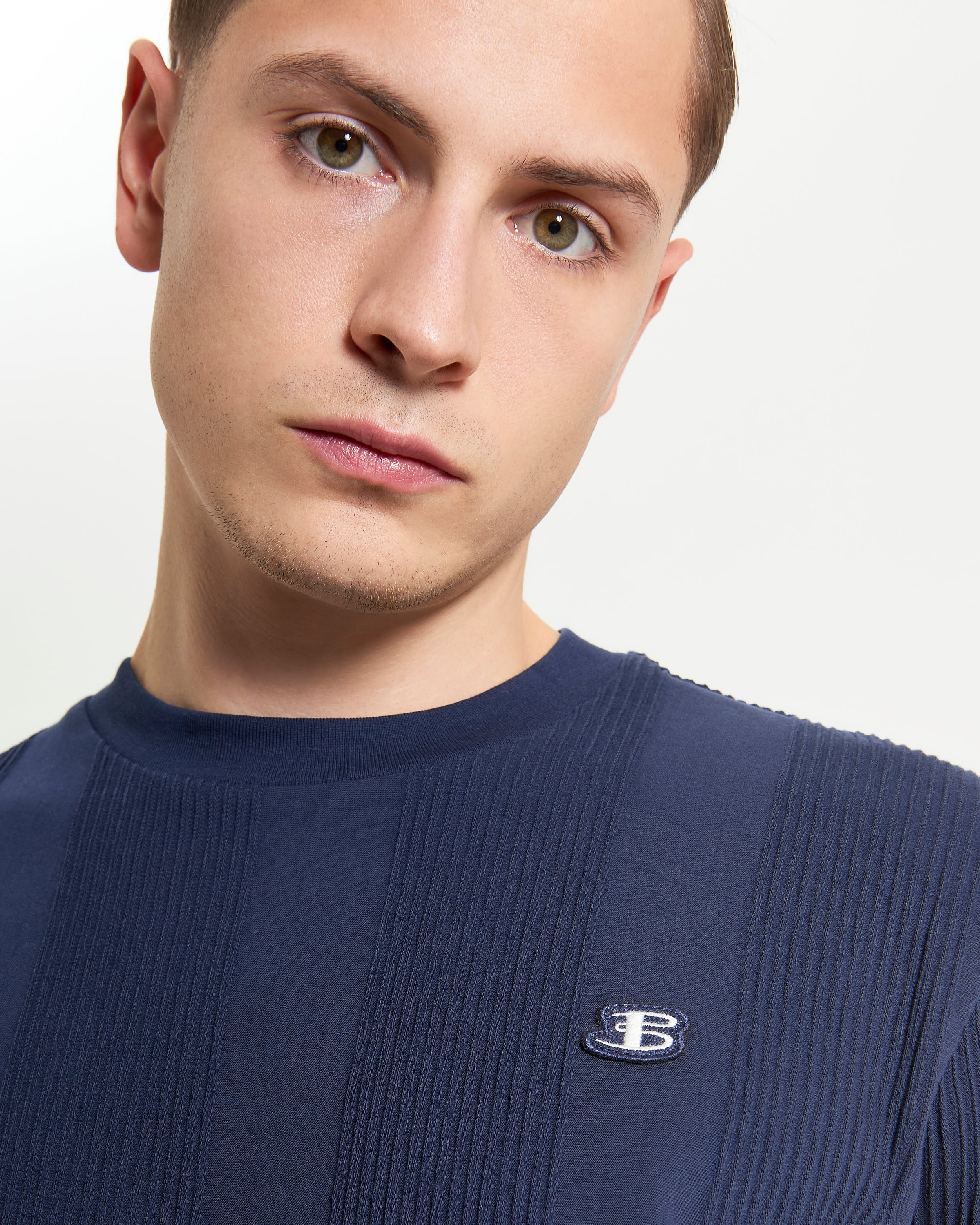 Textured Vertical Stripe Tee – Navy color featuring vertical striped design and relaxed fit with 'B' badge branding.