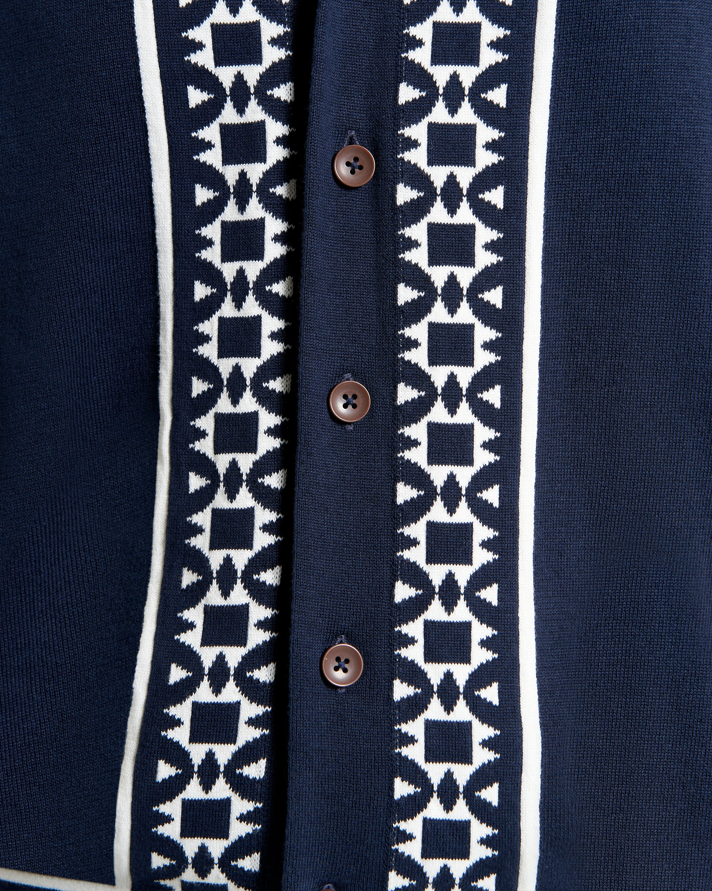 Floral Border Resort Shirt – navy blue short-sleeve shirt with geo border print and button-through placket.
