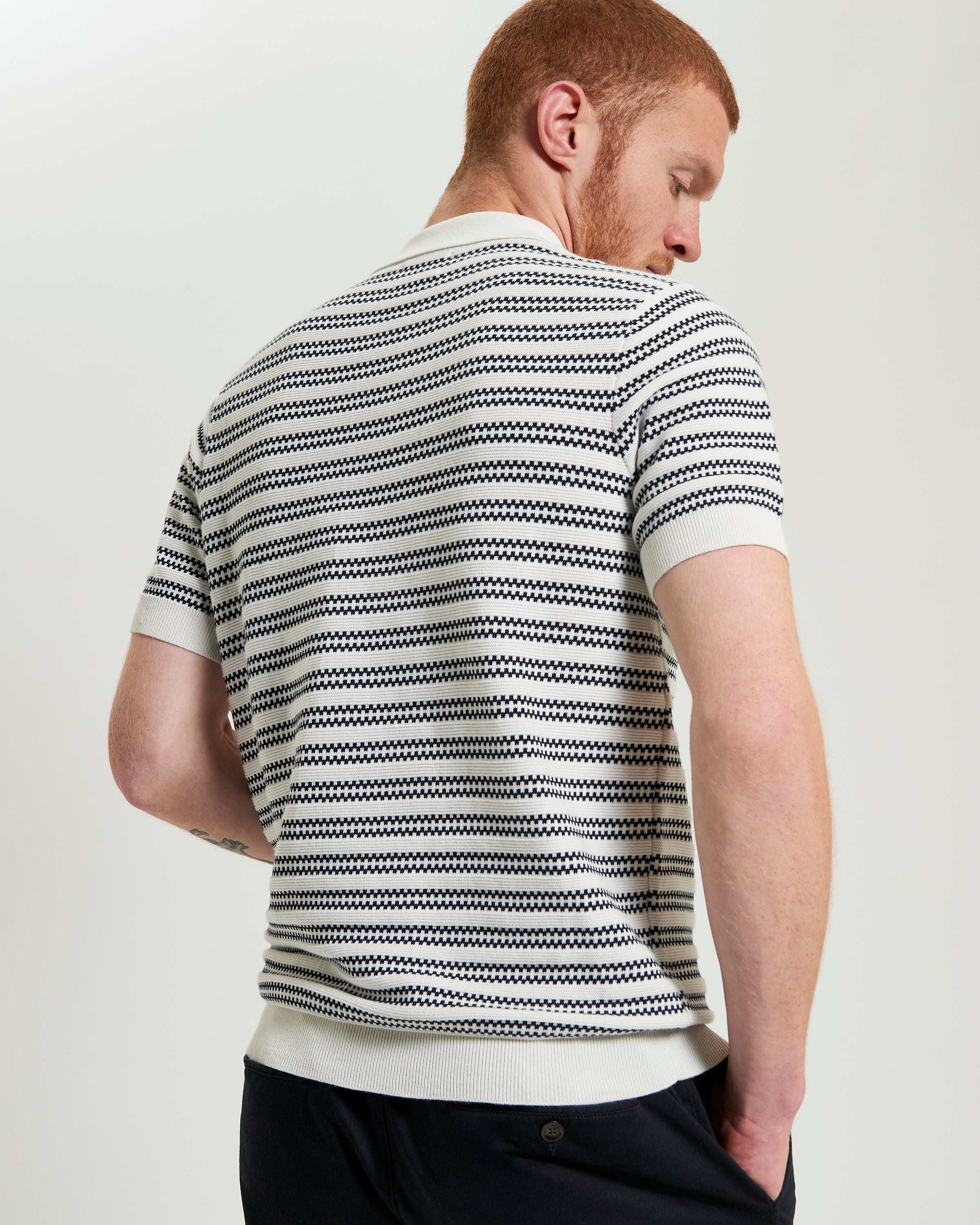 Jacquard Stripe Polo – back view showing intricate stripe pattern and ribbed collar.