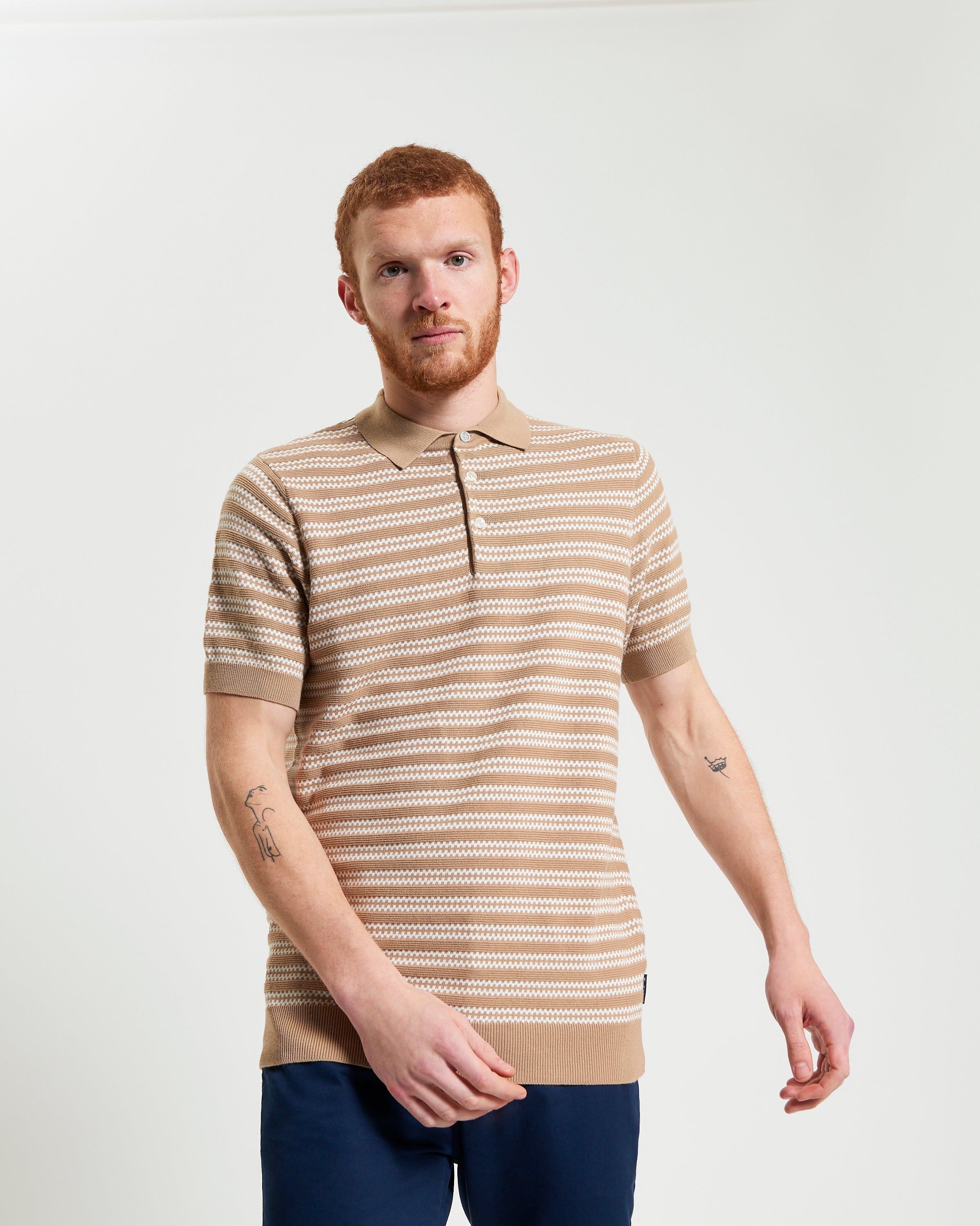 Jacquard Stripe Polo – beige short-sleeve knit with intricate stripe pattern and ribbed collar, perfect for warm-weather style.