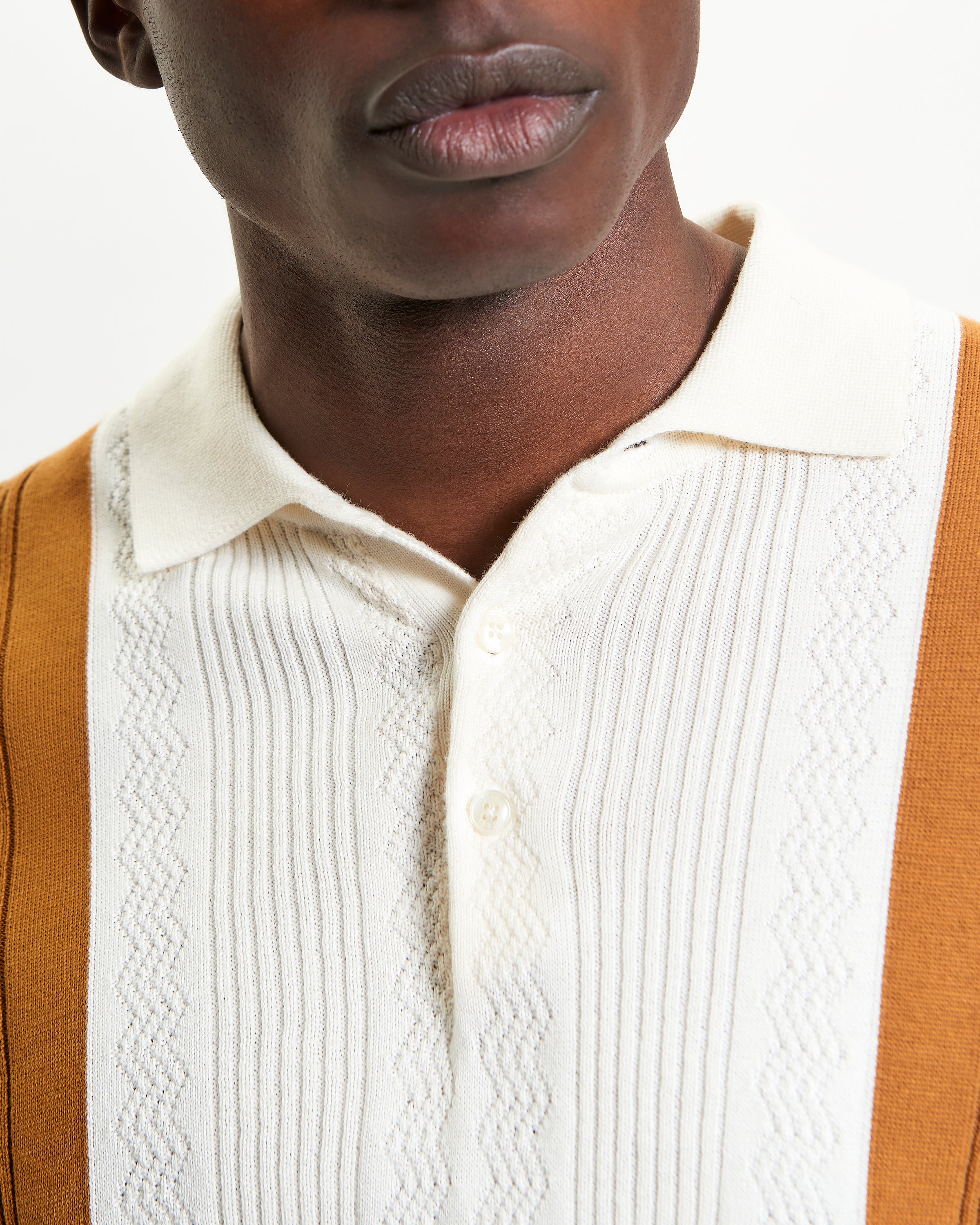 Textured Block Stripe Polo – close-up of collar and buttons in warm colors, showcasing elegant stripe texture.