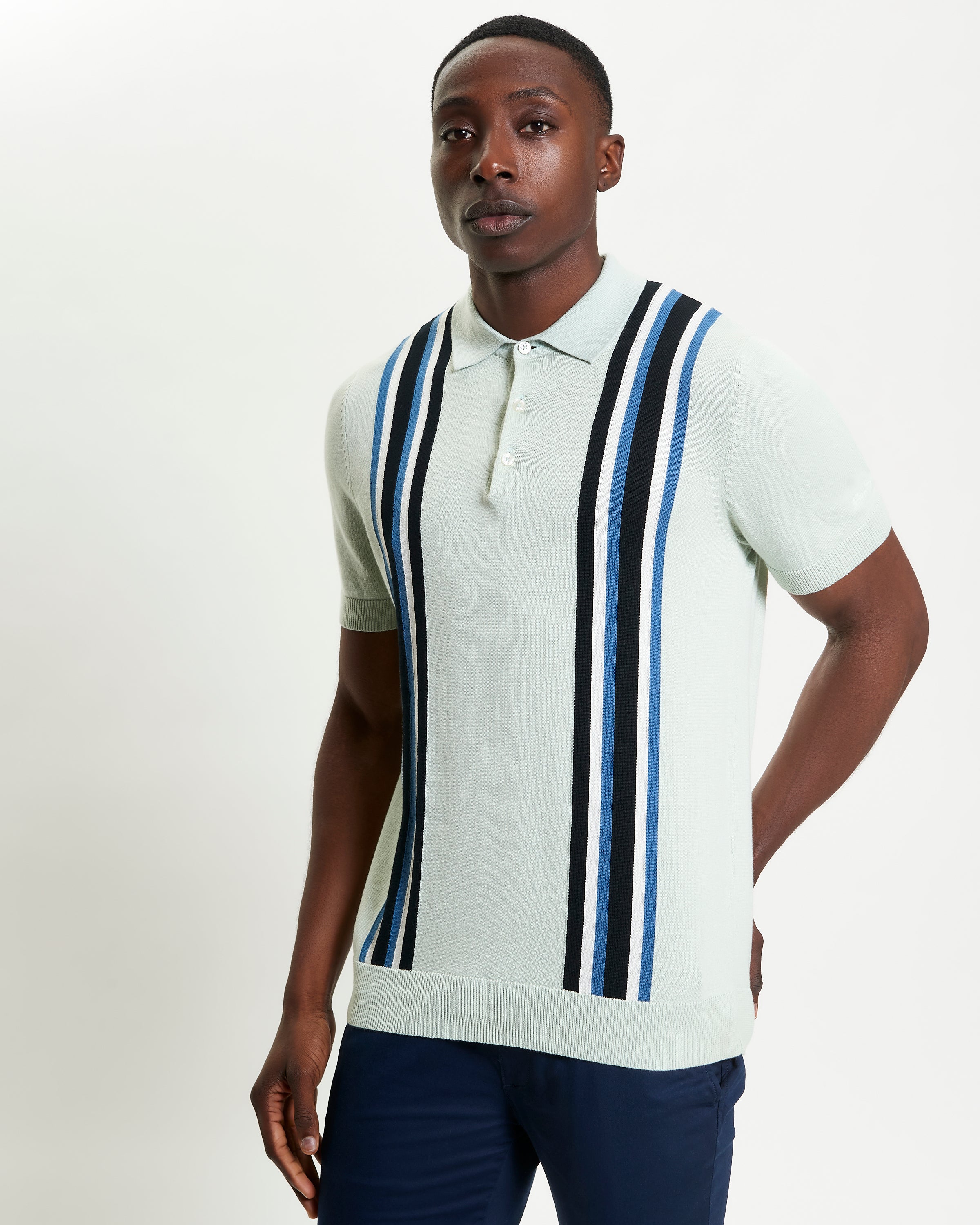 Vertical Stripe Polo – light green with bold stripes, perfect for casual weekends.