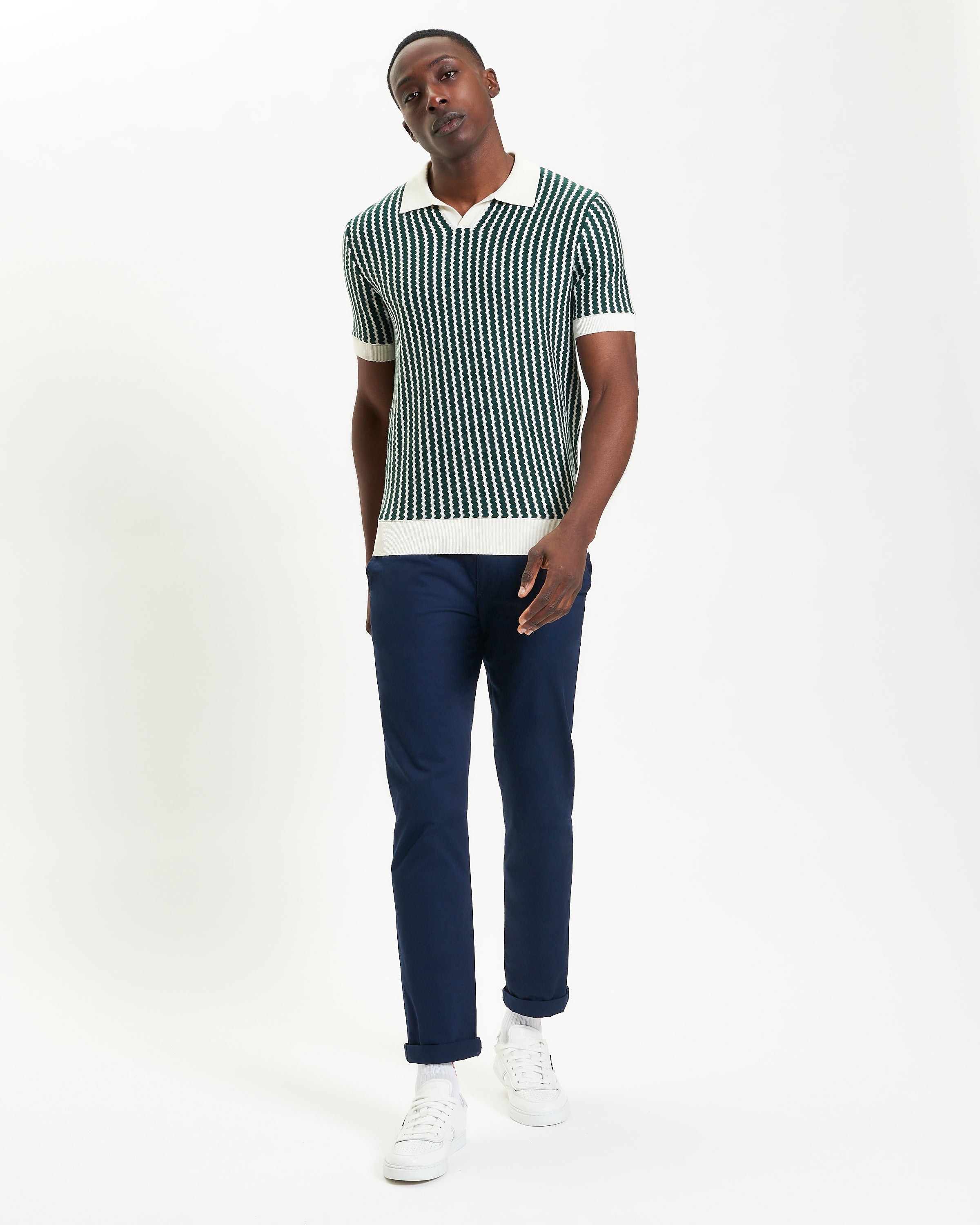 Vertical Wave Polo – green and white vertical wave design knitted polo shirt with open neckline and relaxed fit.