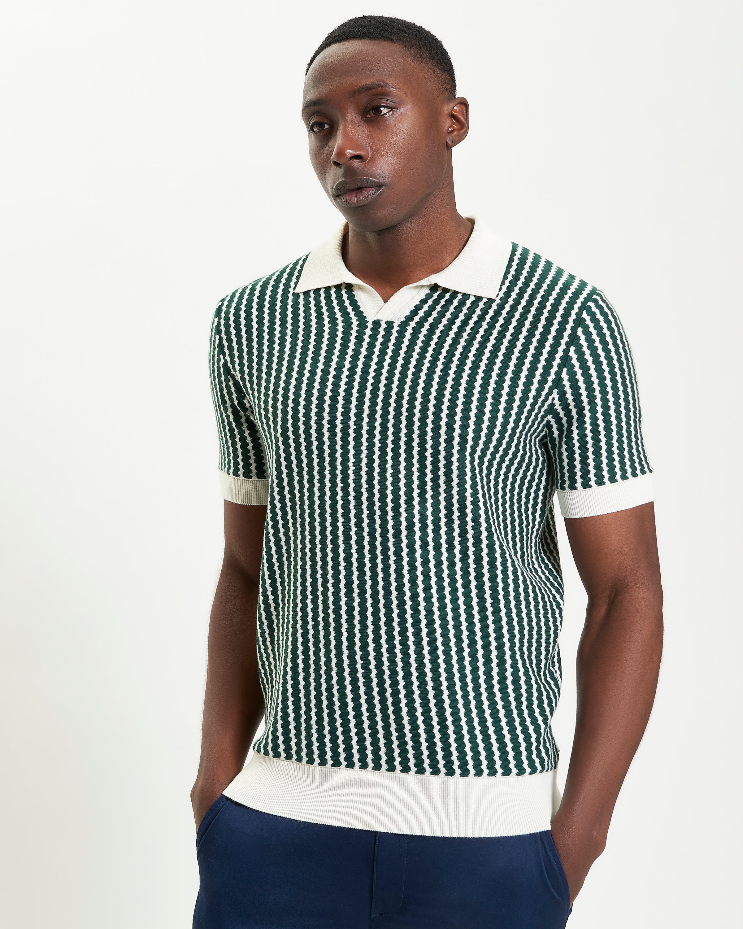 Vertical Wave Polo – green and white vertical wave pattern, relaxed fit with open neckline.