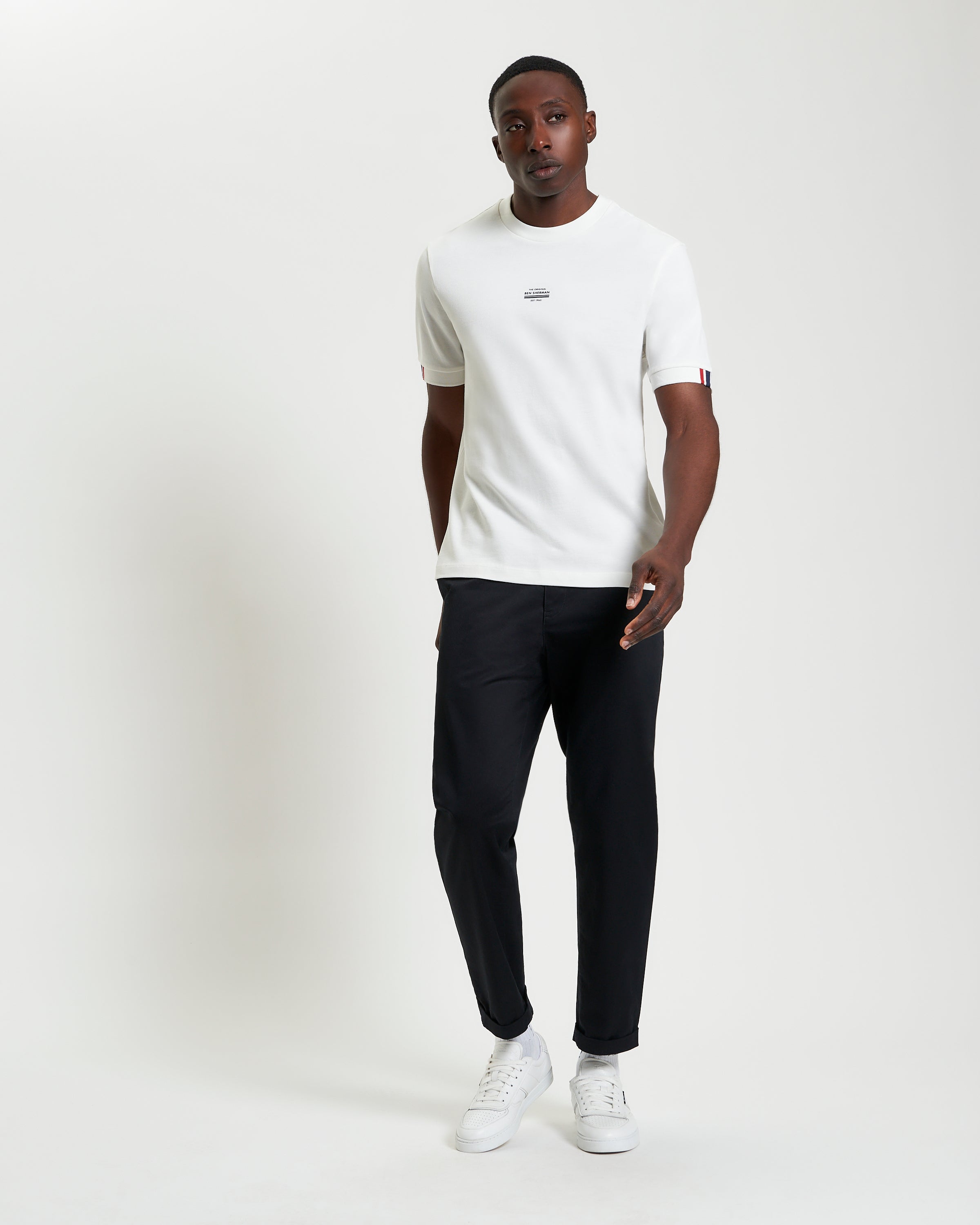 Tipped Pique Tee – relaxed fit piqué cotton fabric showcased in a model wearing it with casual pants.