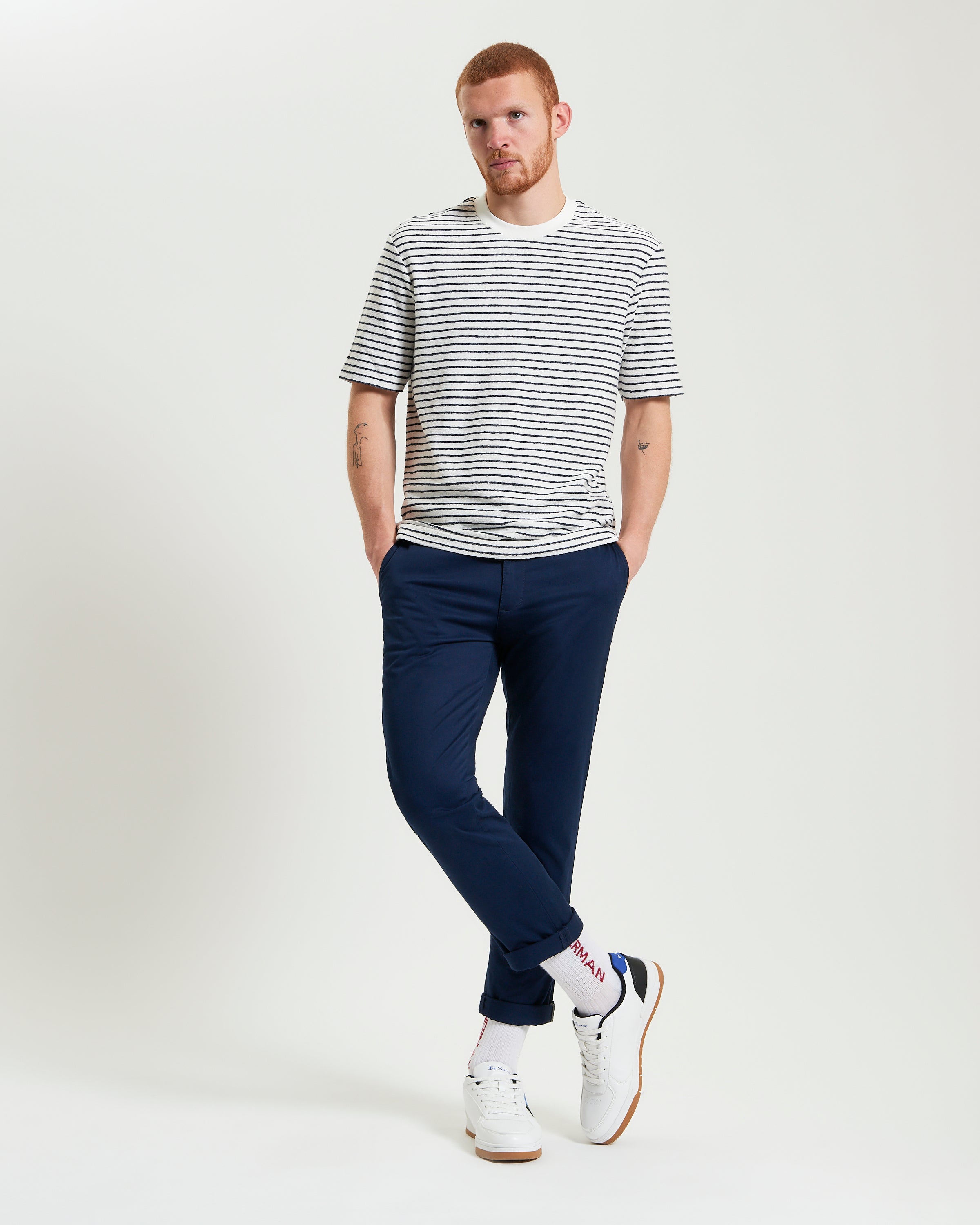 Textured Stripe Tee – styled with navy pants and casual shoes, showcasing a relaxed fit and classic striped design.