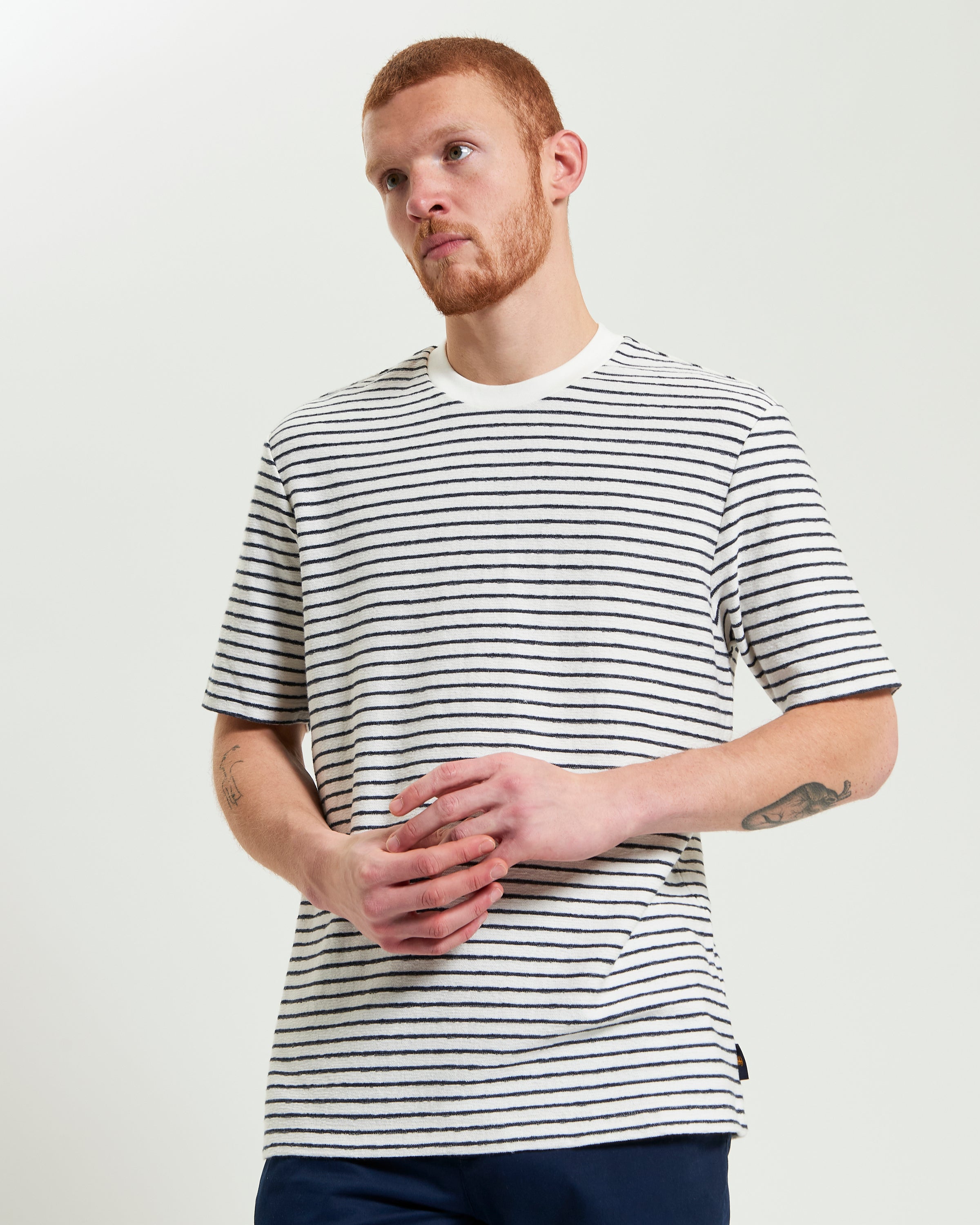 Textured Stripe Tee – a stylish men's t-shirt with a relaxed fit and textured stripes in black and white.