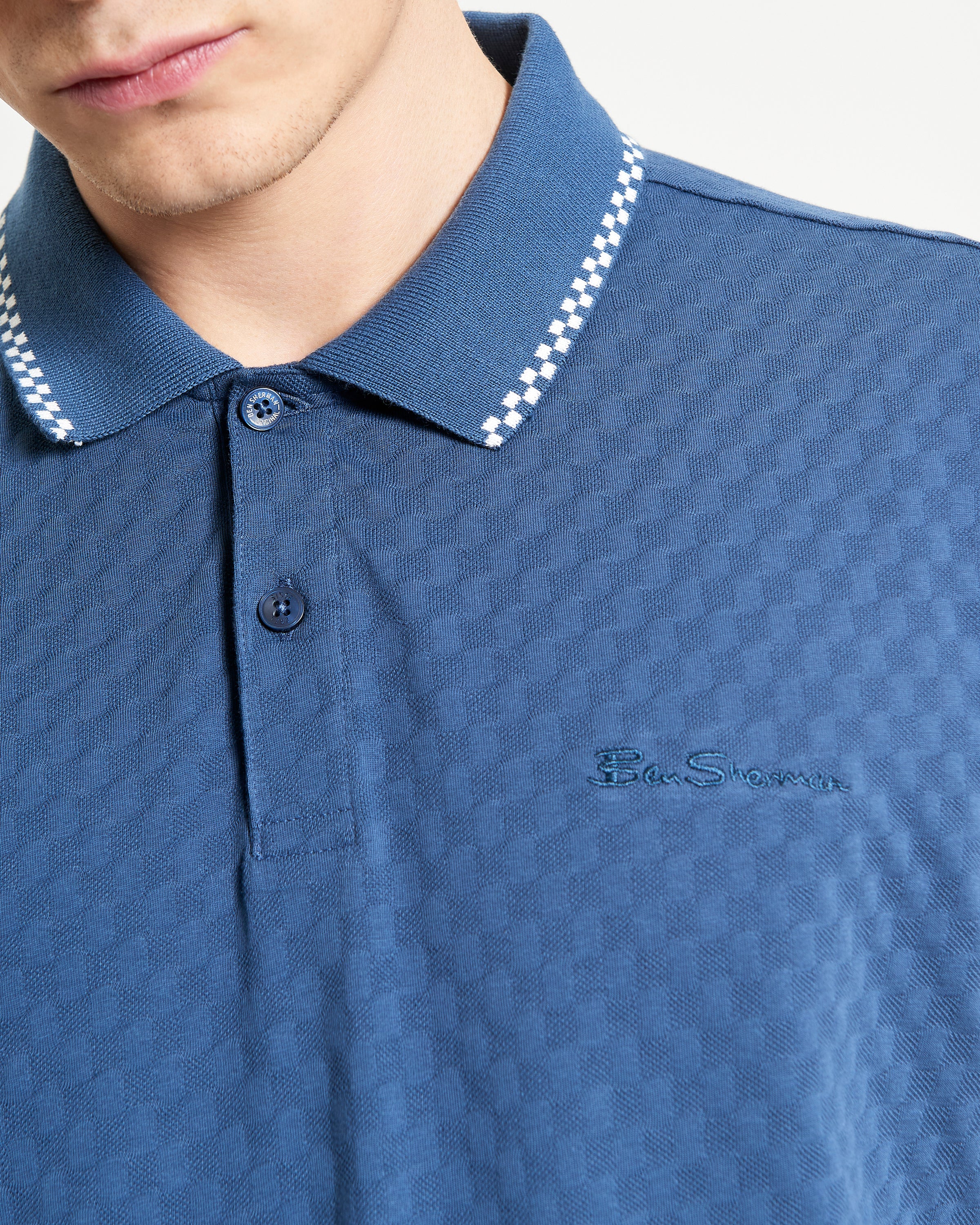 Chequerboard Texture Polo by Ben Sherman in blue with refined texture and two-button placket.