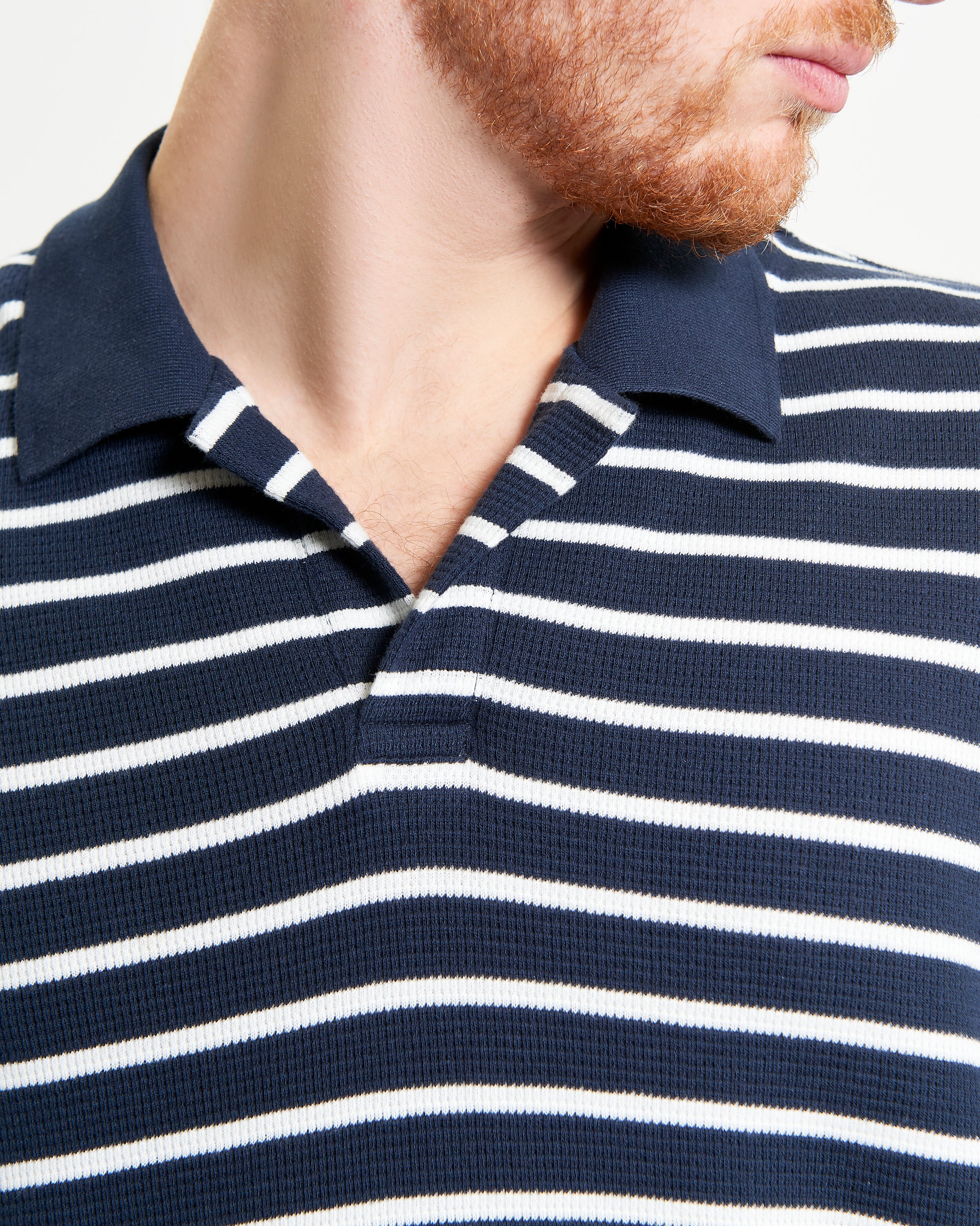 Waffle Stripe Polo – navy and white horizontal stripes with open neck placket, designed for comfort and style.