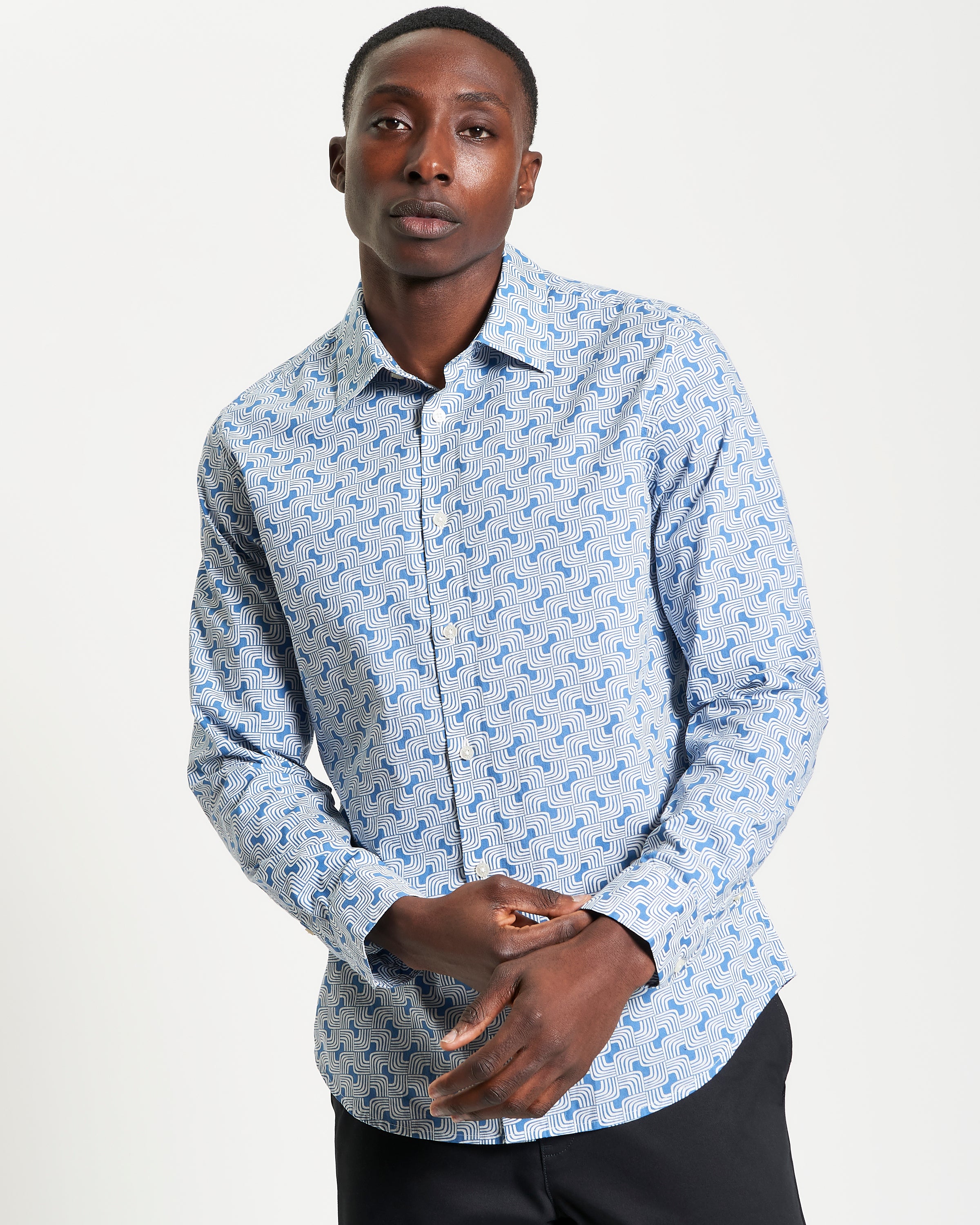 Linear Print – Blue shirt featuring a casual point collar and curved hem for versatile style.