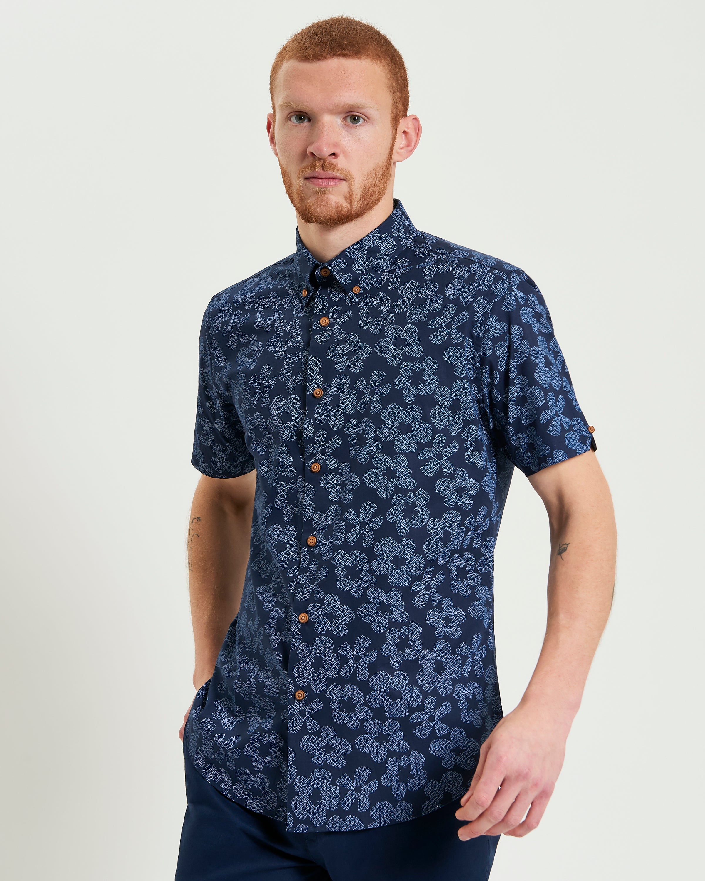 Stipple Floral Print – navy floral shirt with button-down collar and short sleeves, crafted from organic cotton.