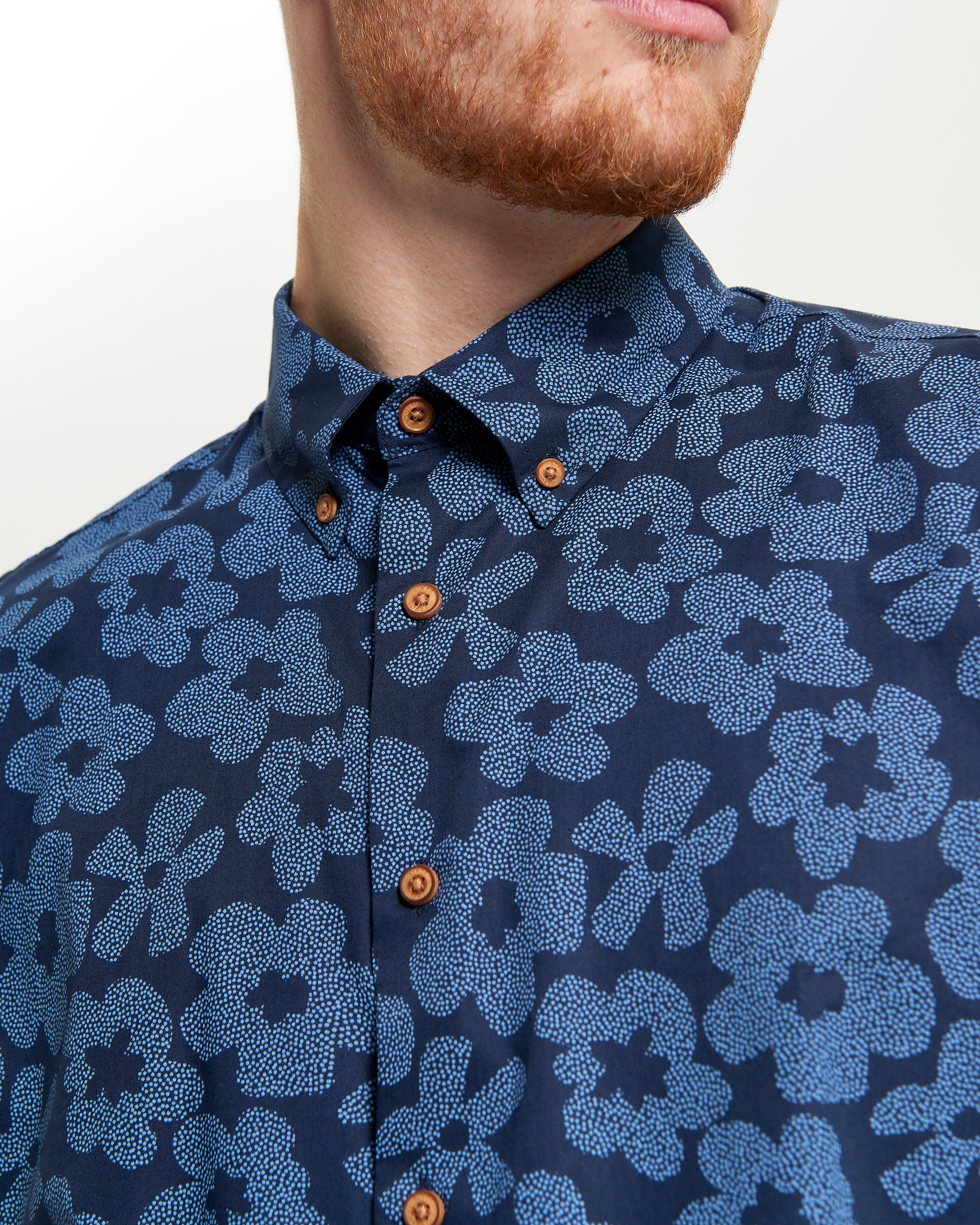 Stipple Floral Print shirt featuring a navy blue floral design and button-down collar for smart-casual style.