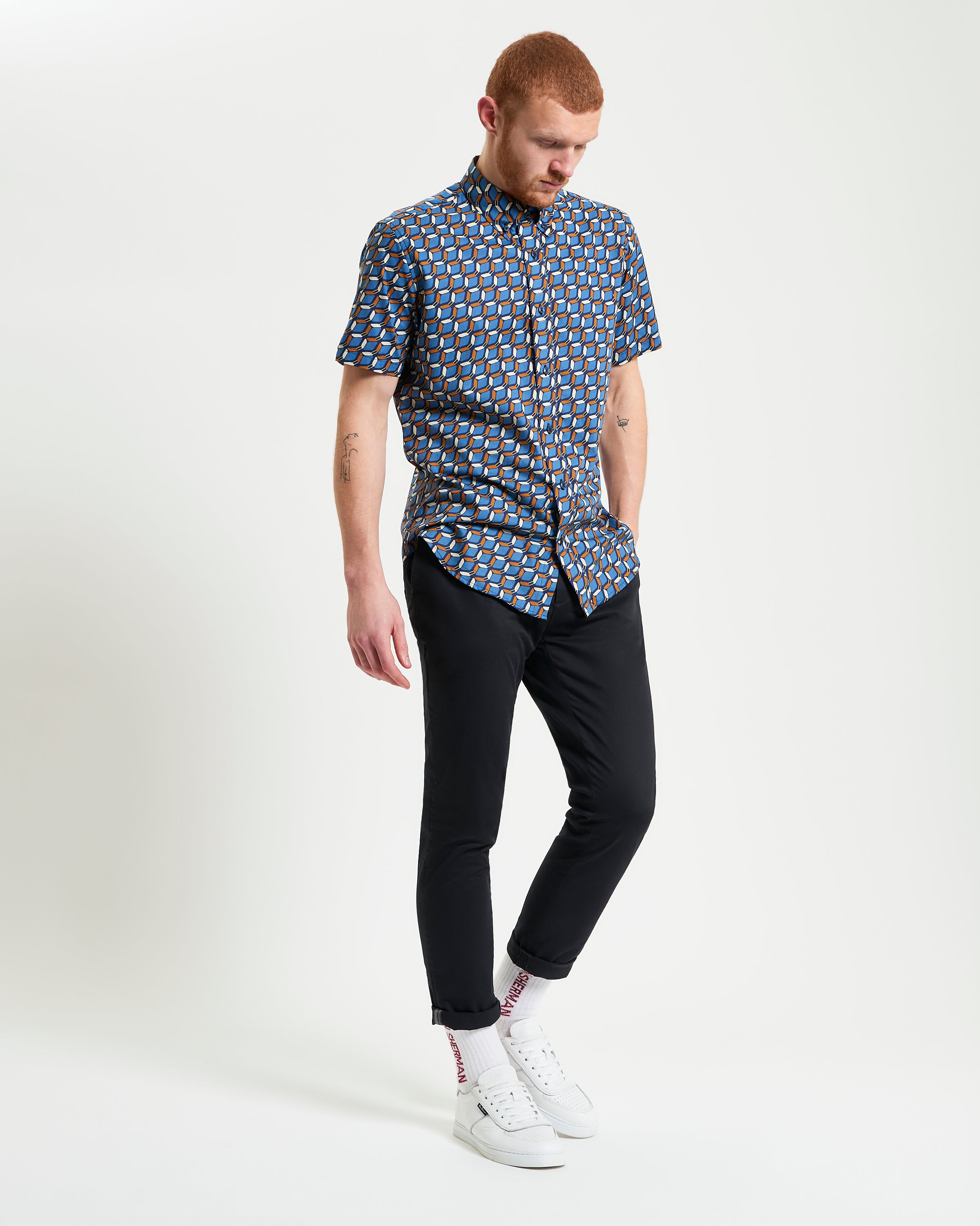 Retro Geo Print shirt worn by a model, showcasing vintage design and bold geo print on organic cotton.