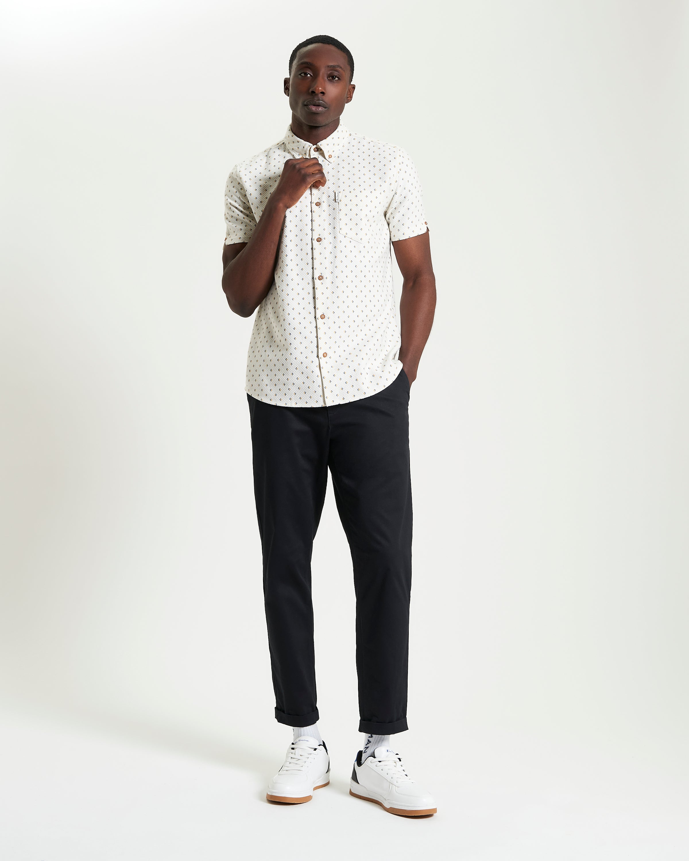 Split Geo Print short-sleeve shirt from Ben Sherman on a model, featuring a two-finger button-down collar.