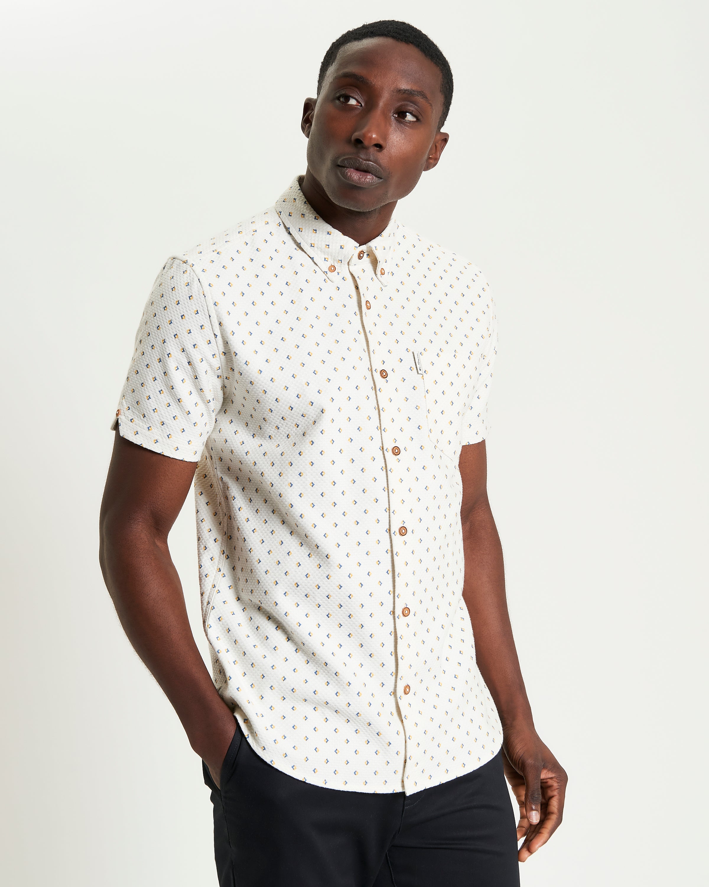 Split Geo Print short-sleeve shirt featuring a two-finger button-down collar and a regular fit.