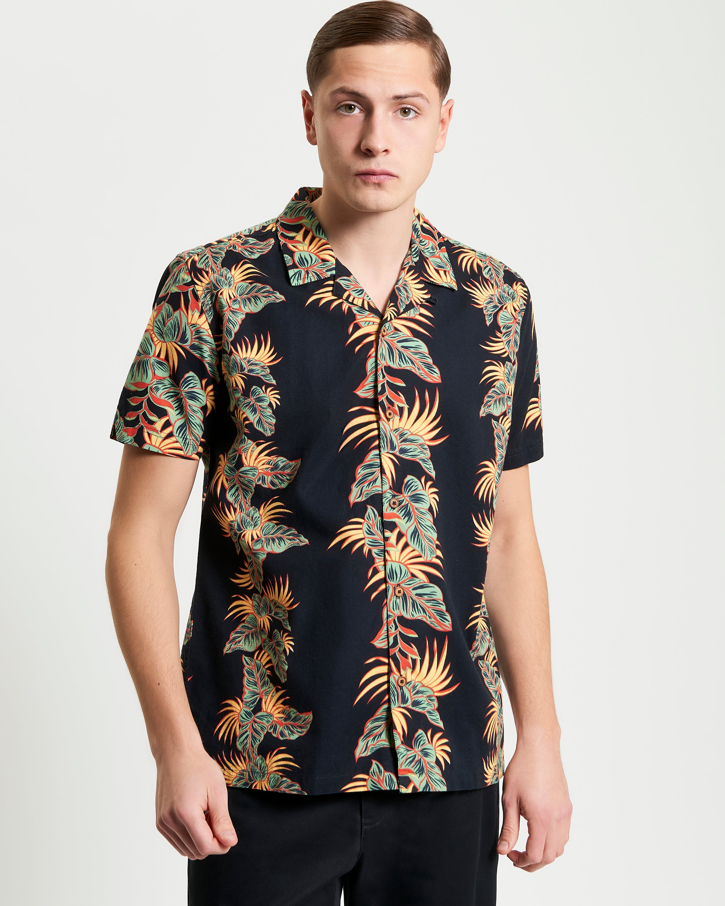 Botanical Leaf Print short sleeve shirt featuring bold leaf motif and relaxed fit.