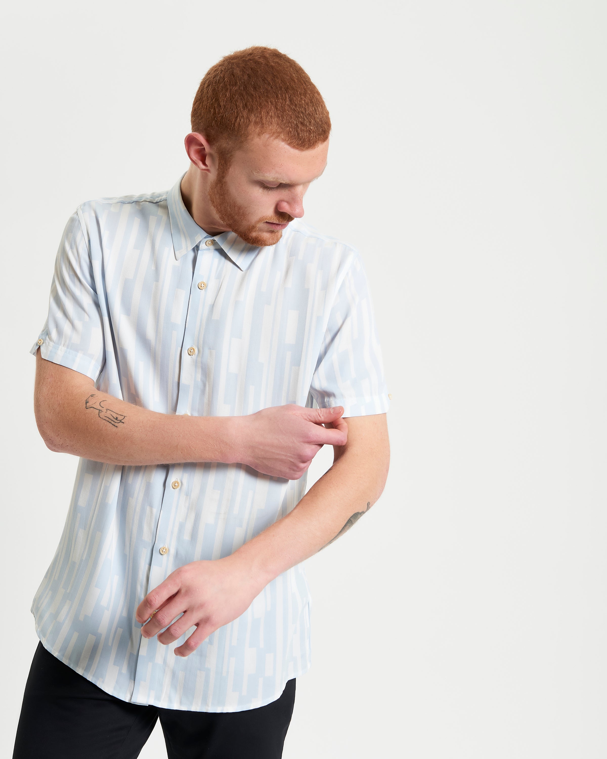 Jazz Lines Print shirt with a light blue geometric pattern, showcasing breathable design and button-down collar style.